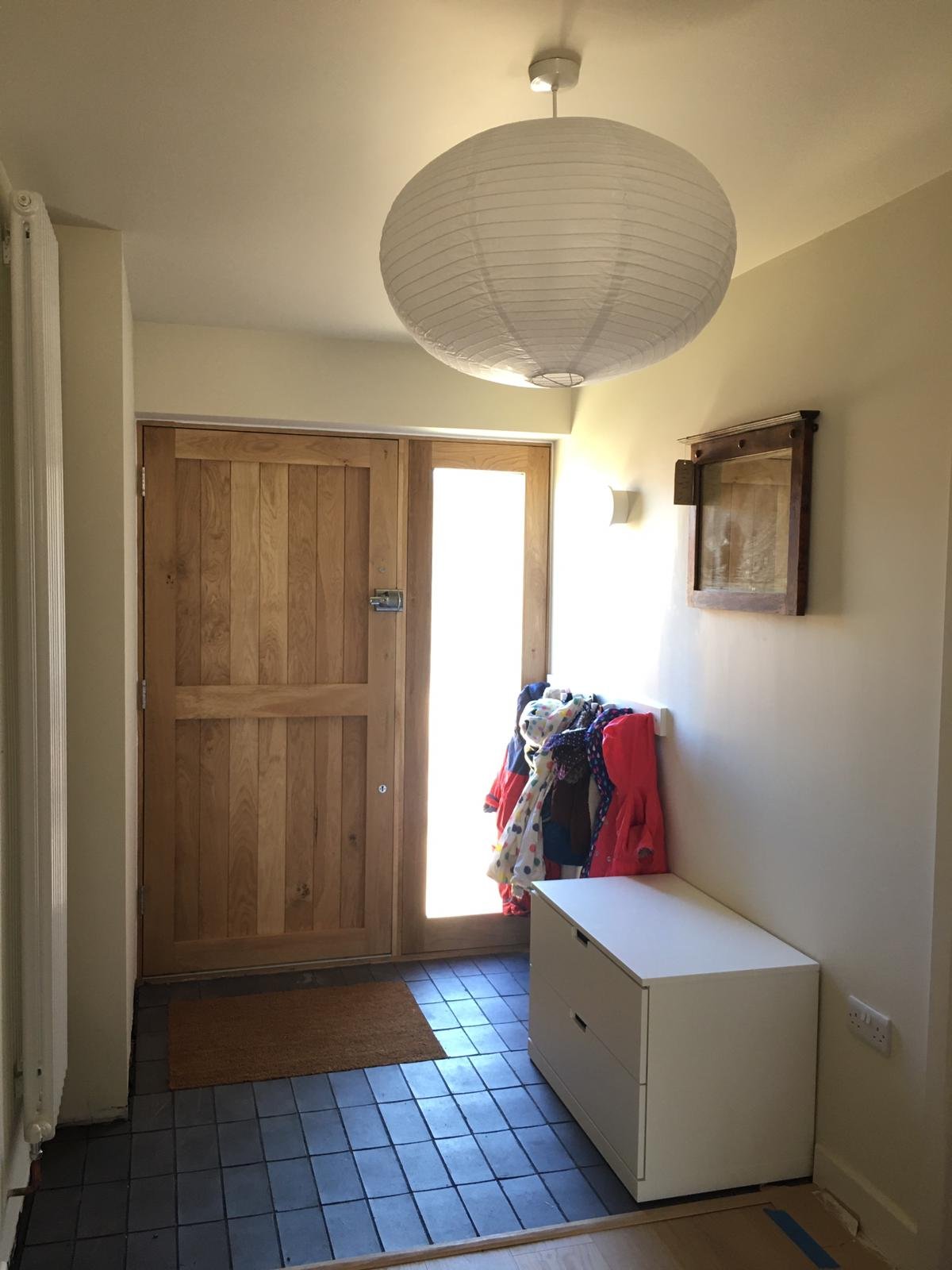 Entrance hall reconfigured to create more space.