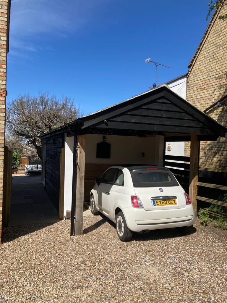After - convenient car port added.