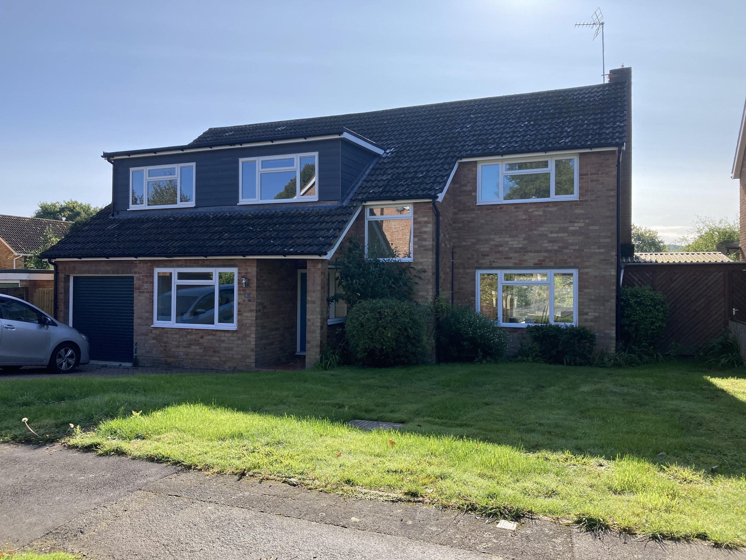 After - front elevation ‘in keeping’ with the existing house .