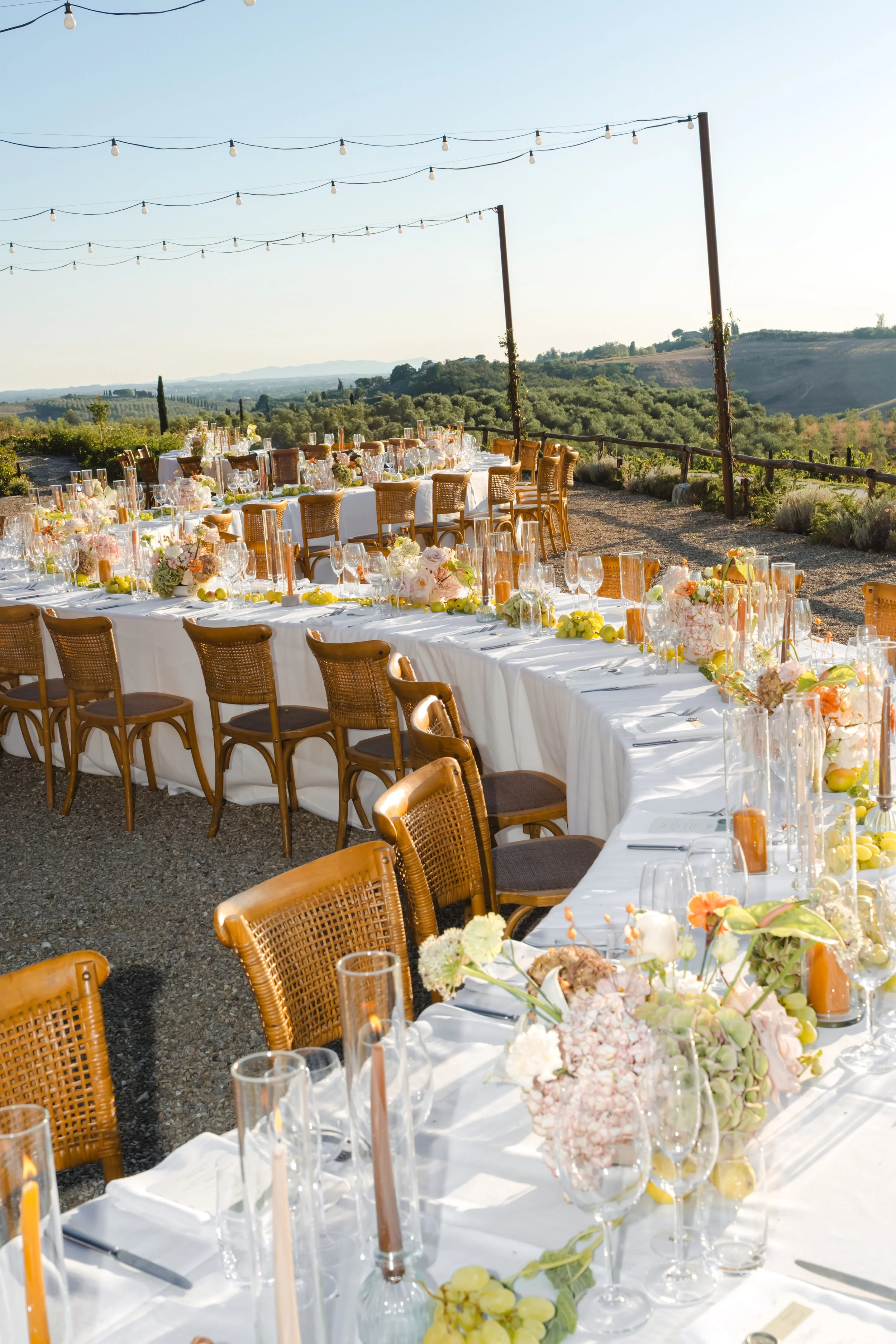 table flower arrangements on a serpentine shape table in tuscany