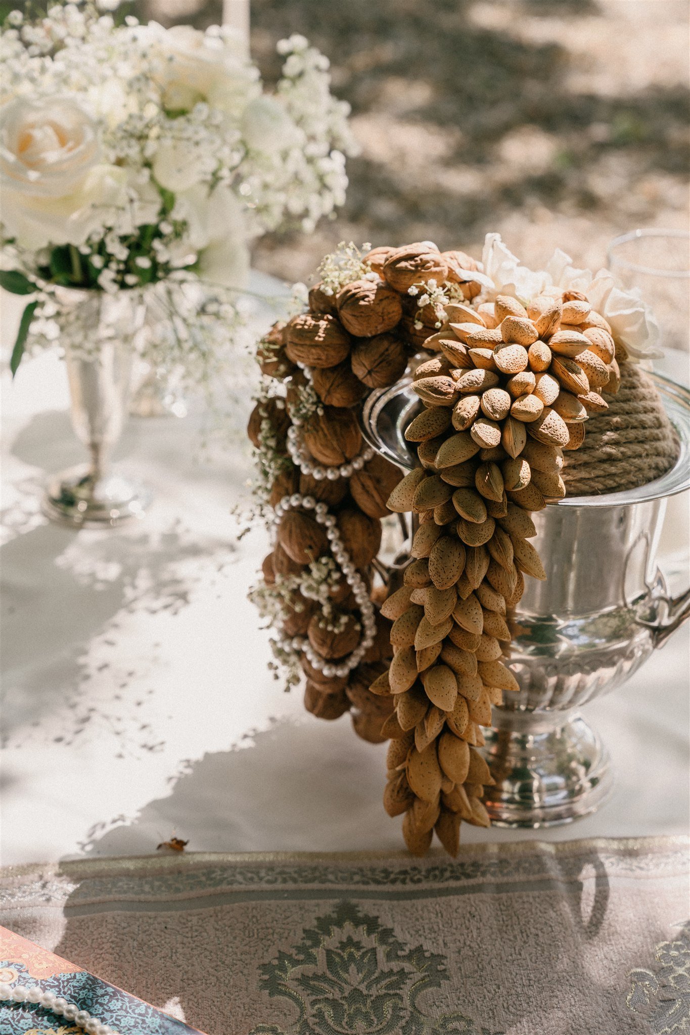 Pinecones and symbolic elements on traditional Sofreh Aghd table