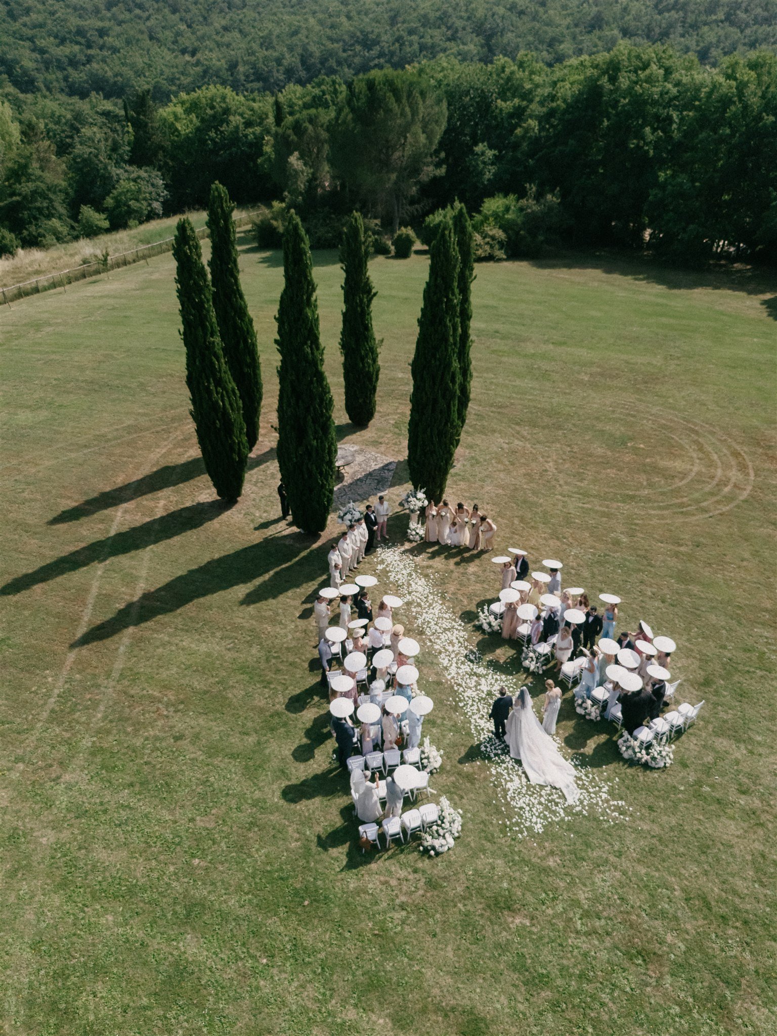 Aerial view of outdoor wedding ceremony at Villa Nemora with cypress trees