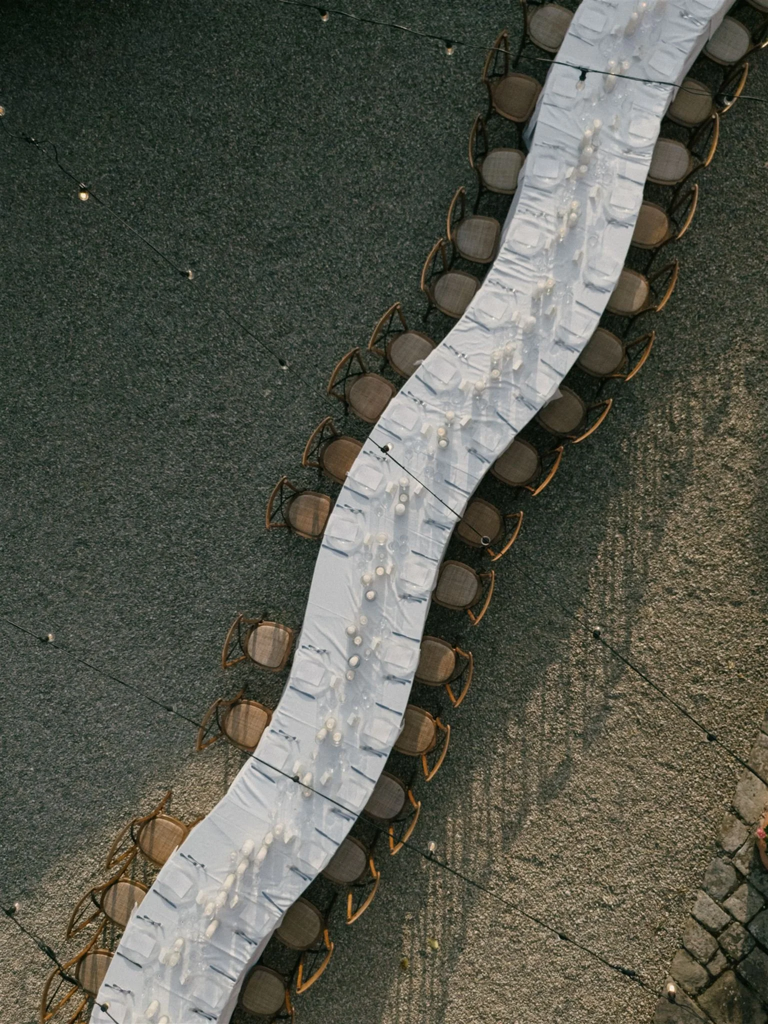 Long reception table setup in courtyard at Villa Nemora