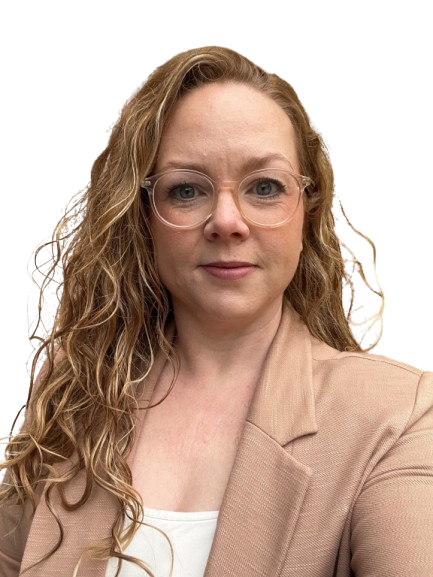 A woman with curly blonde hair, wearing glasses and a beige blazer, looking directly at the camera.