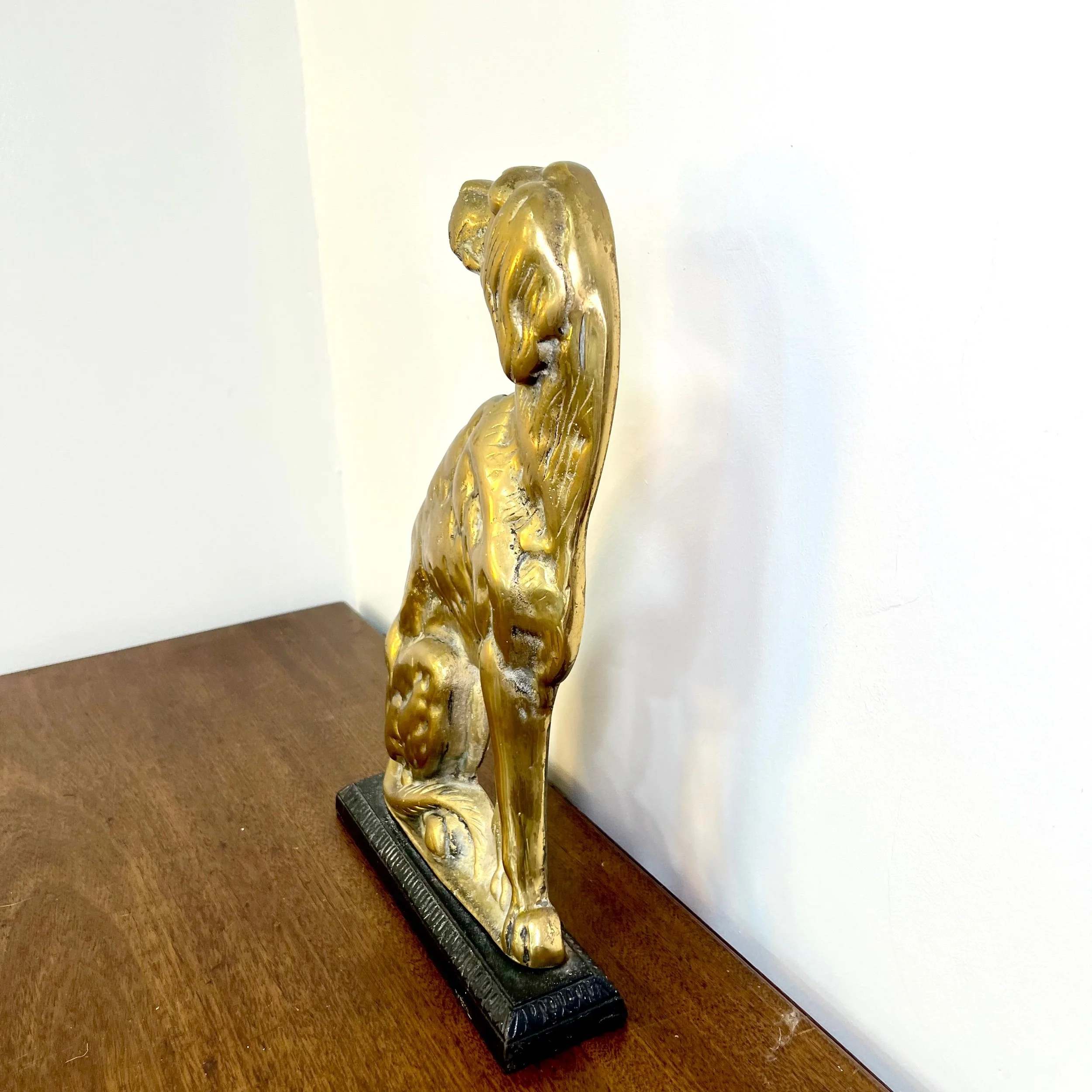 Brass dog shaped door stop