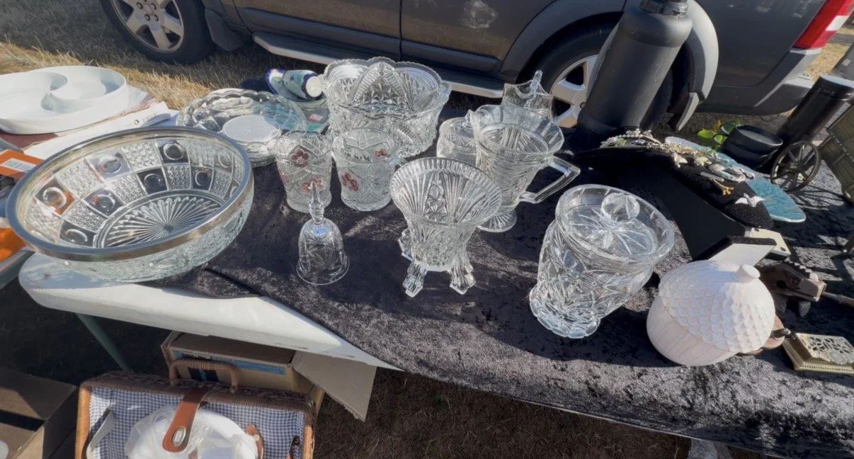 Vintage cut crystal jars on a table at a UK car boot sale