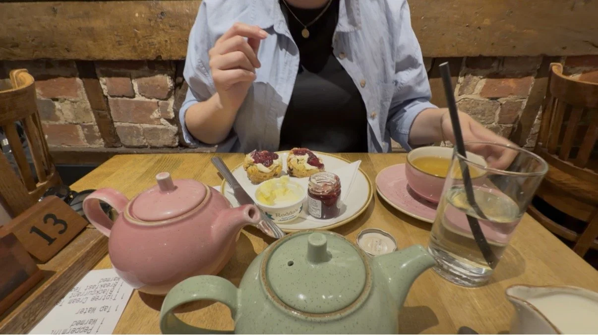 verhead view of a cream tea for two with scones, jam and cream at the Tiptree cafe