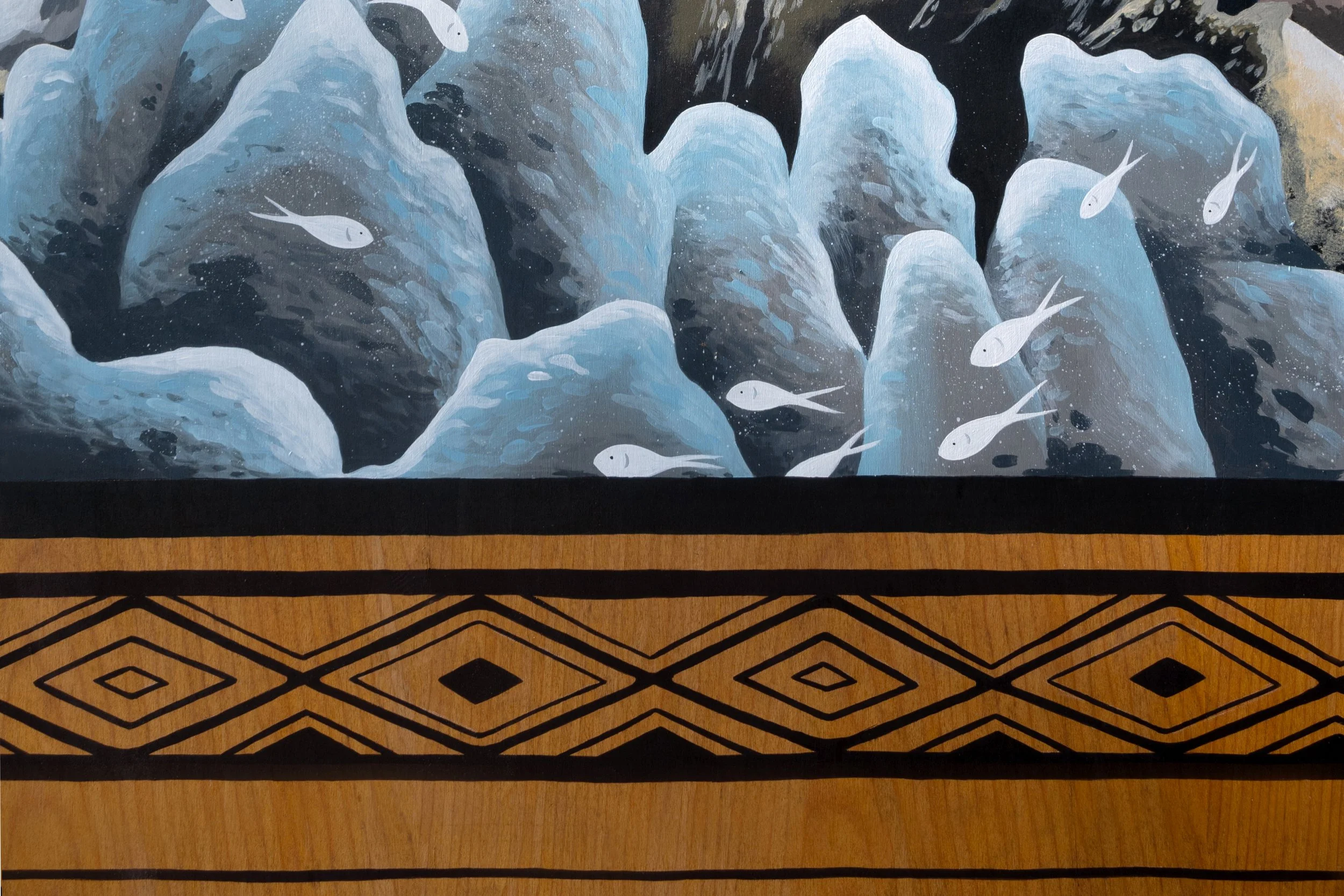 Kirana Retreat - A lively underwater scene featuring a variety of marine species. Painted on a wooden closet used to store watersport equipment at the resorts  watersport centre.