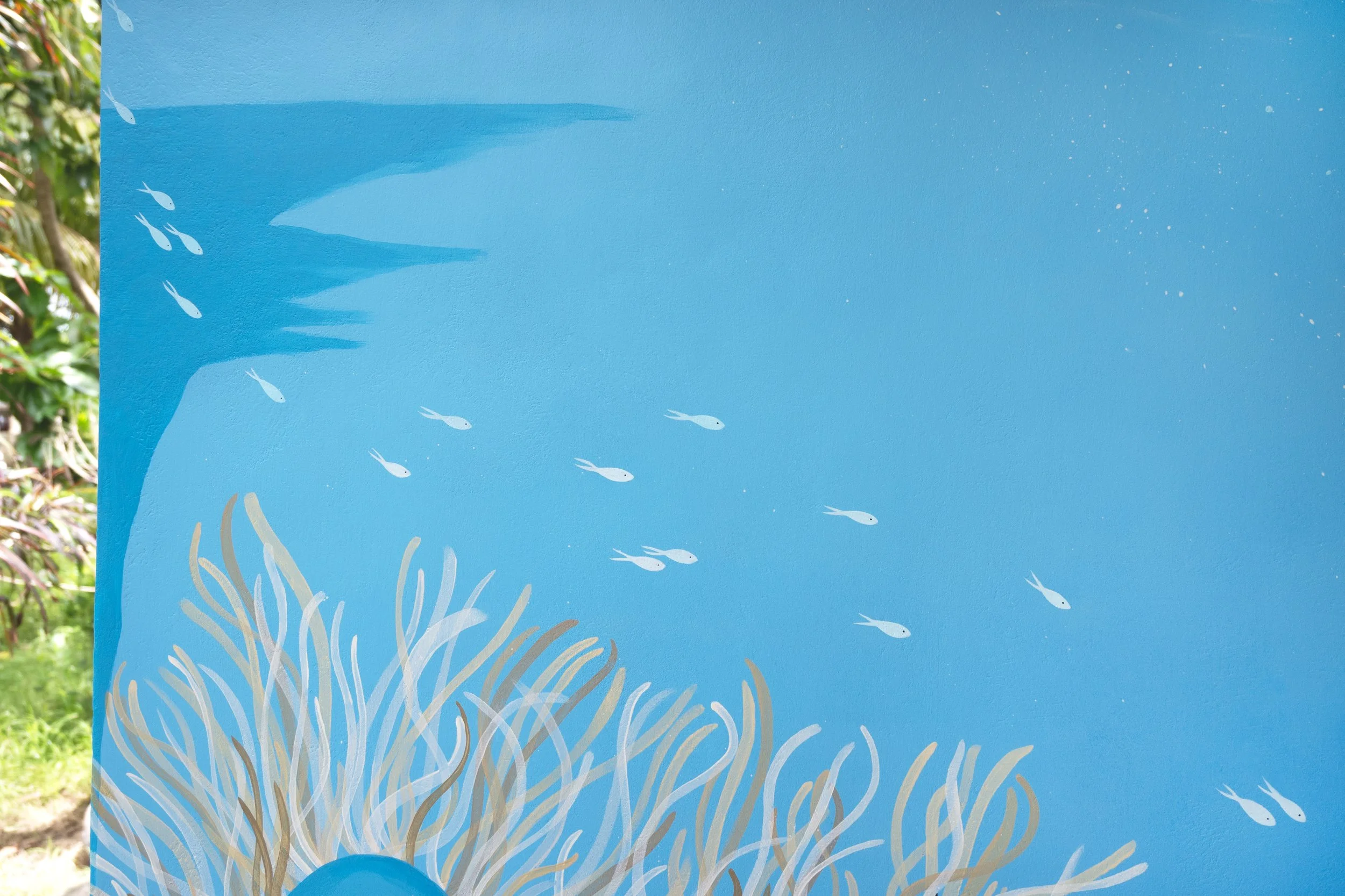 Puri Yalus Homestay - Spinner dolphins pass by the reef of a crystal clear bay. Painted on the reception wall in Crystal Bay area. 