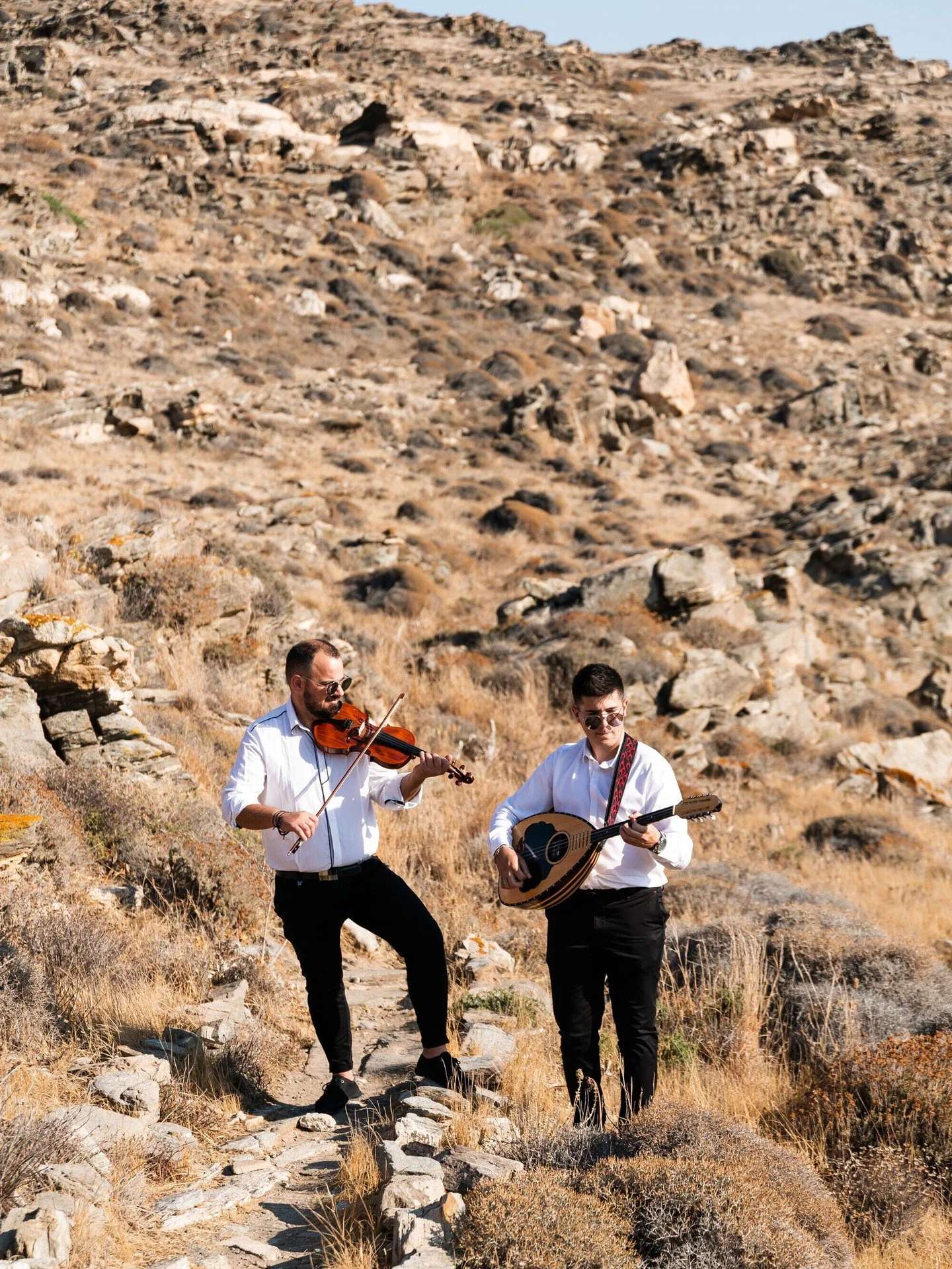 traditional musicians led the way for the couple down the aisle at an island wedding in Greece

photo: @7th_art_
