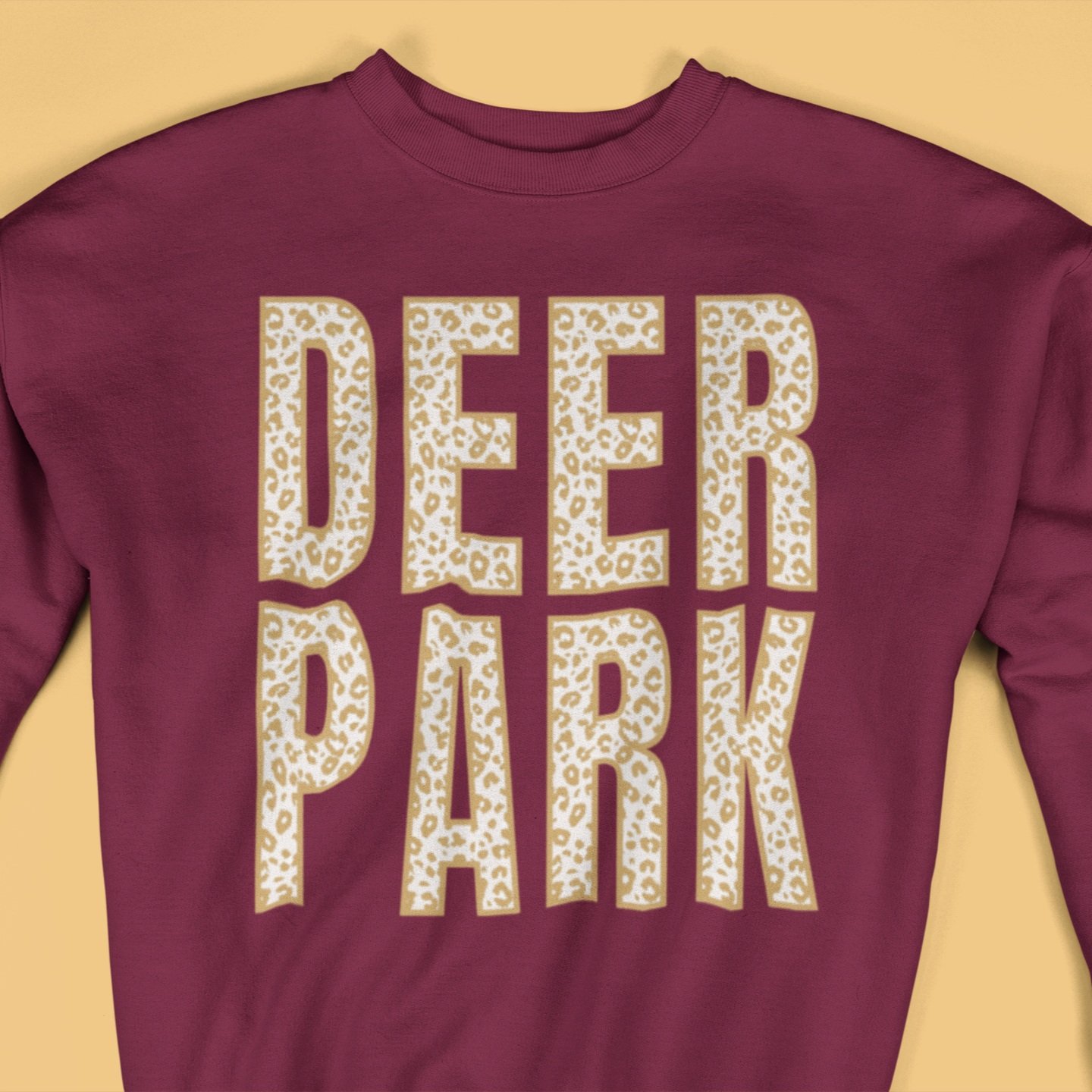 closeup-of-a-crewneck-sweatshirt-mockup-lying-on-a-flat-surface-a15246+%282%29.jpg