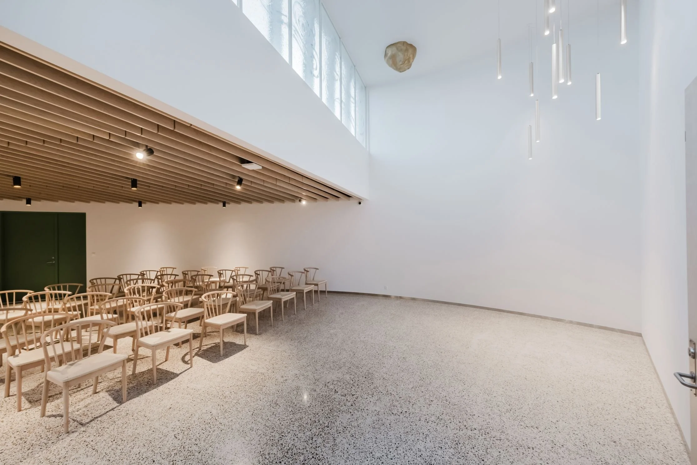 Interior overview of the community house at Sønder Omme Prison with seating and natural light