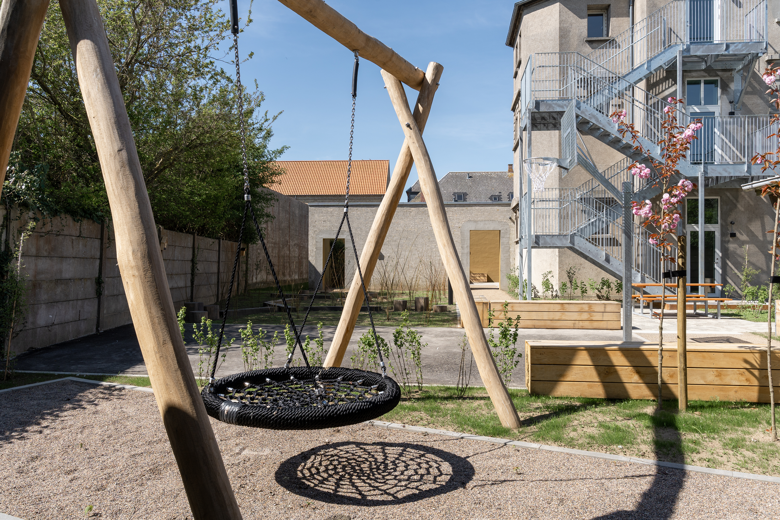 Children's swing in the outdoor play area at Maribo Halfway House