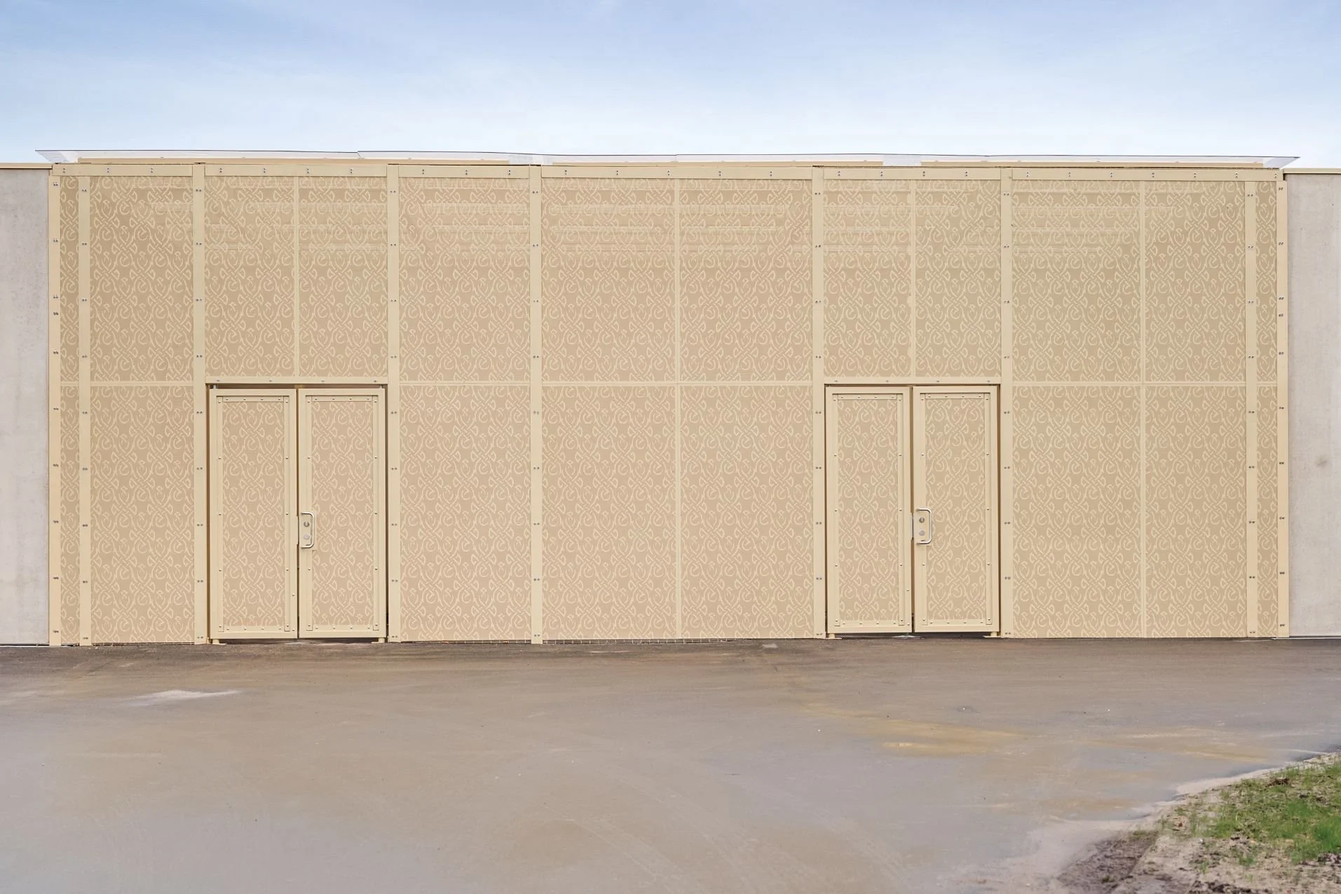 Exterior facade detail with integrated artwork at Sønder Omme Prison