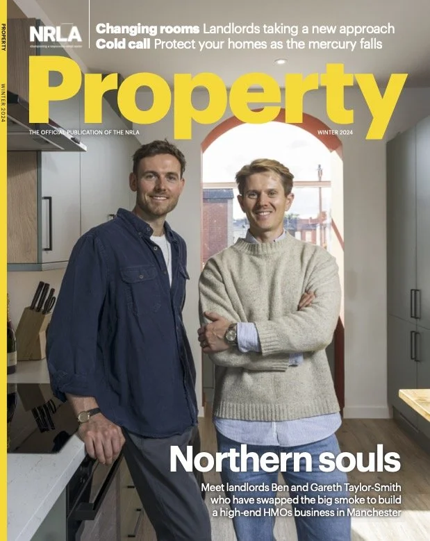 Cover of Property magazine, Winter 2024 issue, showing two men in a modern kitchen, smiling and standing near a window with a cityscape view in the background.