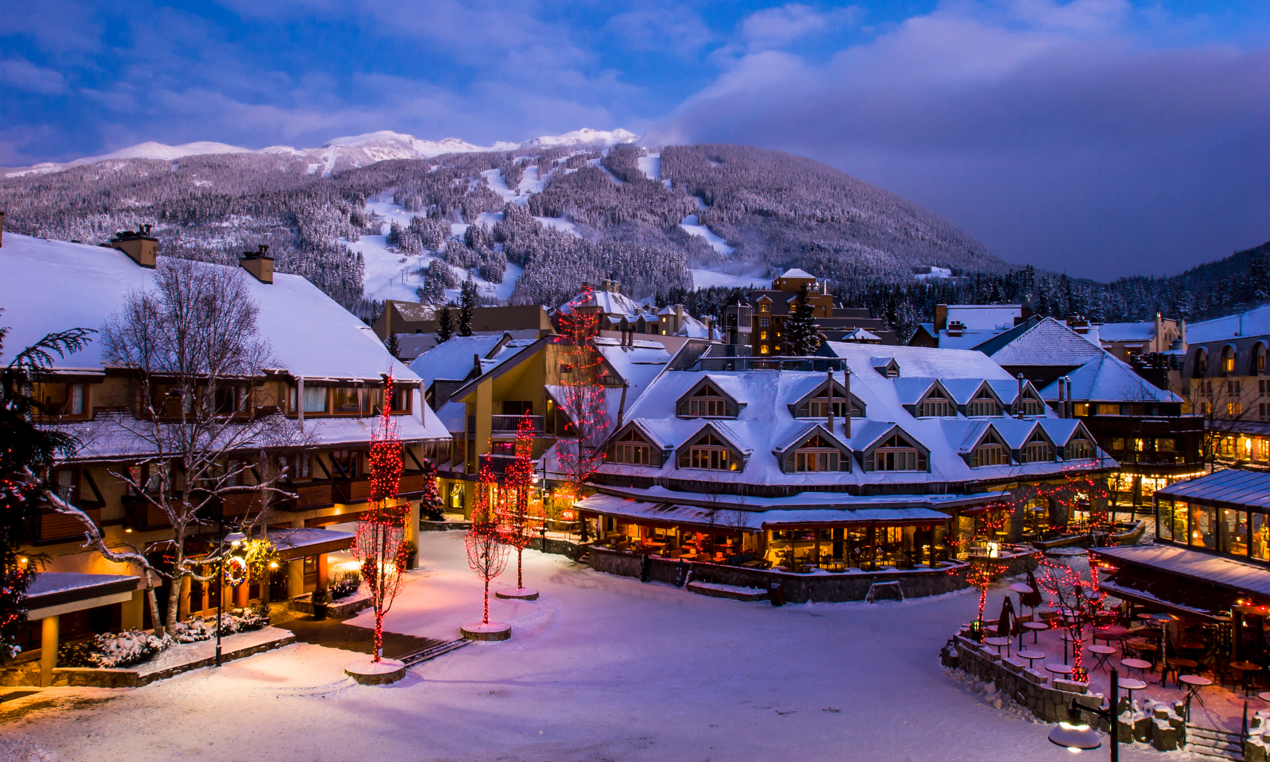 A Whistler strata complex in winter surrounded by snow-covered mountains, representing strata property ownership and depreciation report requirements in BC