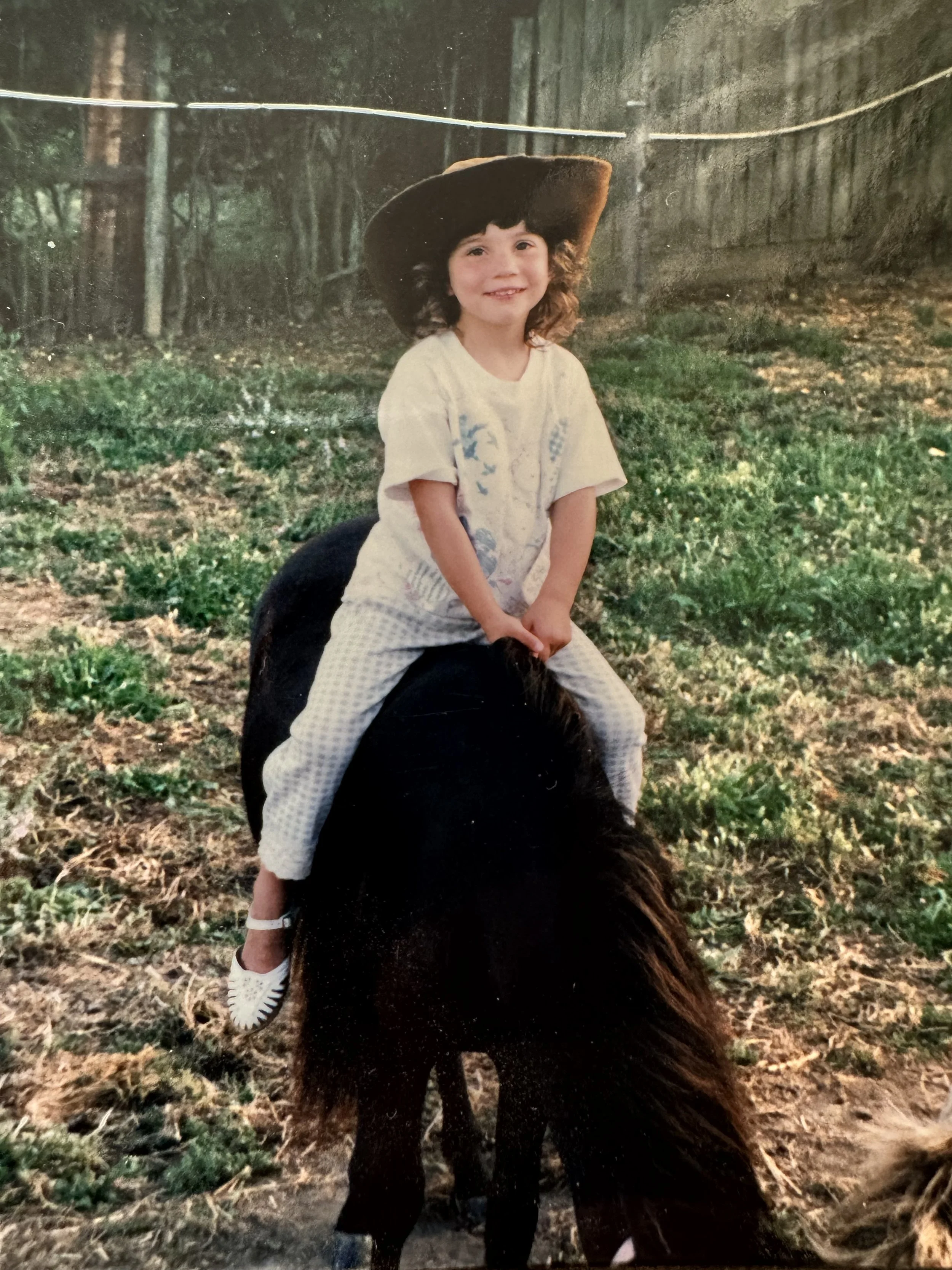 Toddler Angie on a pony