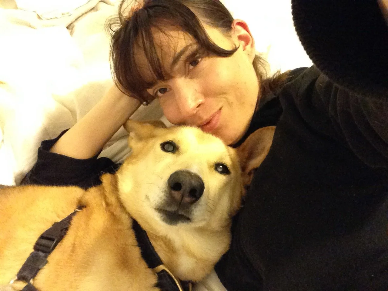 Angie with her heart dog, an Alaskan Husky named Gonzo
