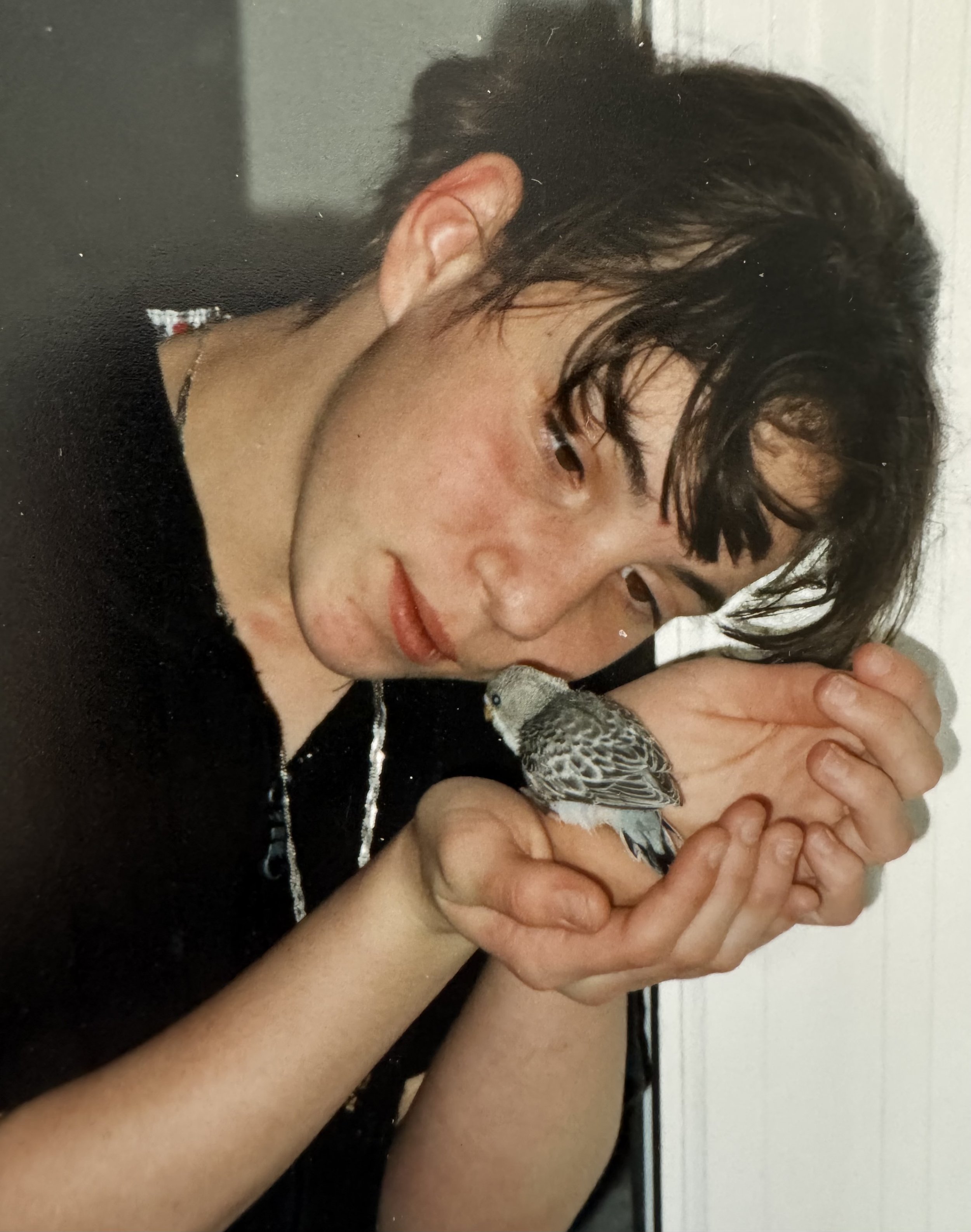 Teenage Angie with a baby Budgie that she hand raised