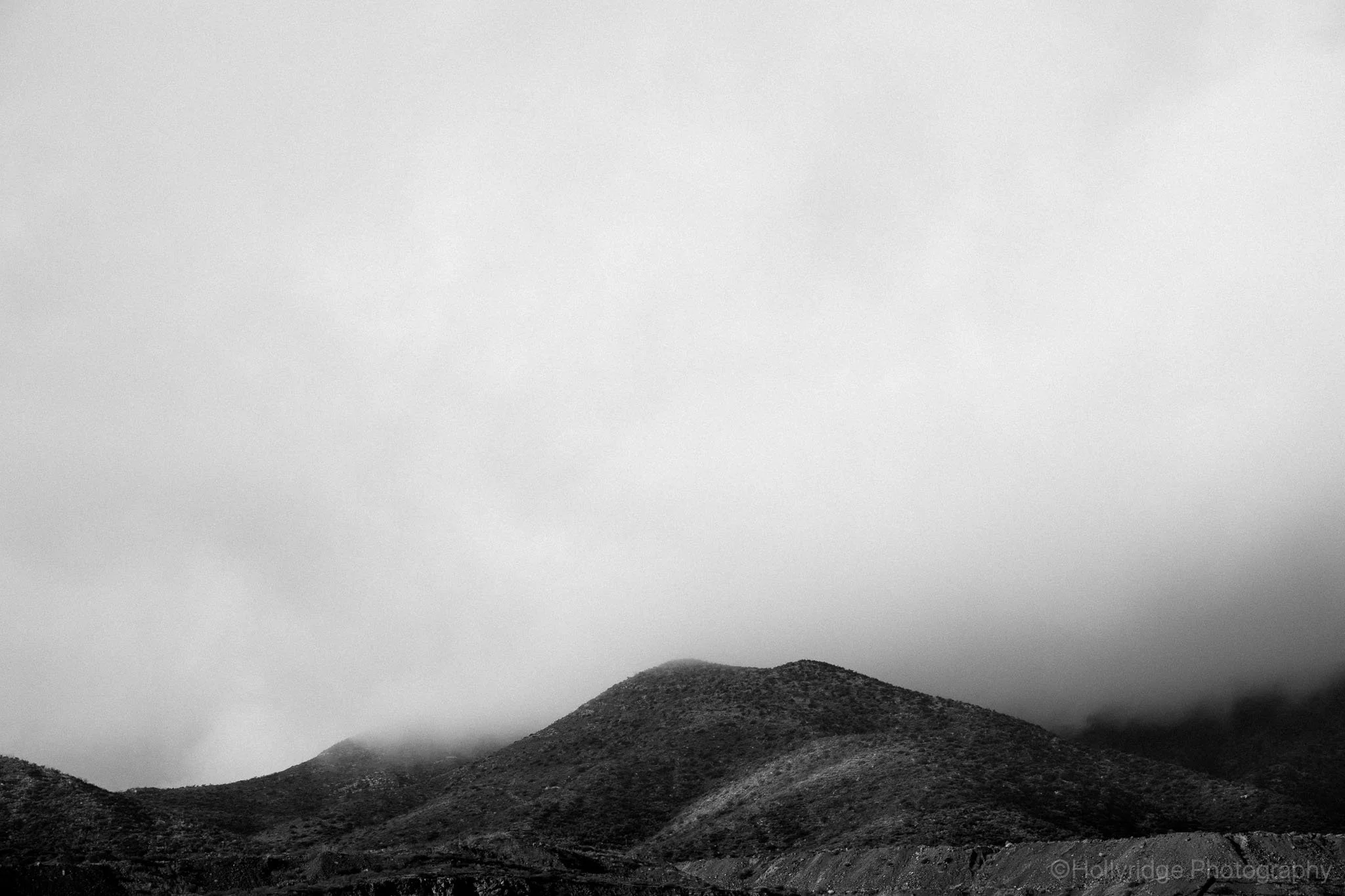Misty mountain landscape overlooking Bisbee, Arizona with hazy atmosphere