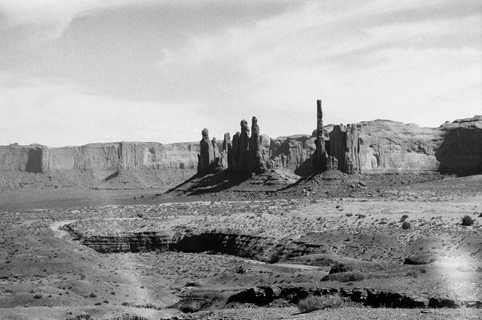 Black and white Monument Valley rock formations in analog landscape photography