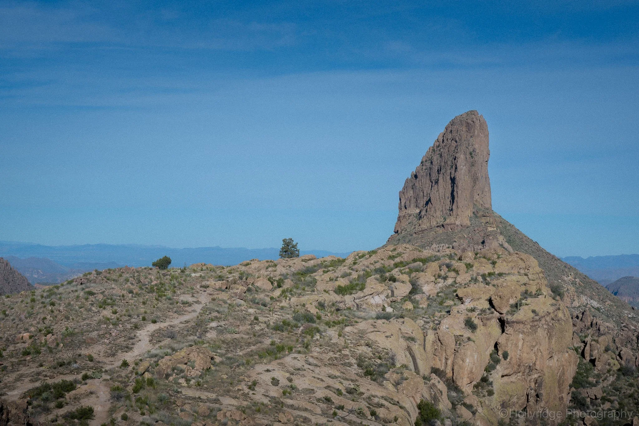 Weaver’s Needle rock formation rising above desert terrain in the Superstition Mountains near Gold Canyon, Arizona.