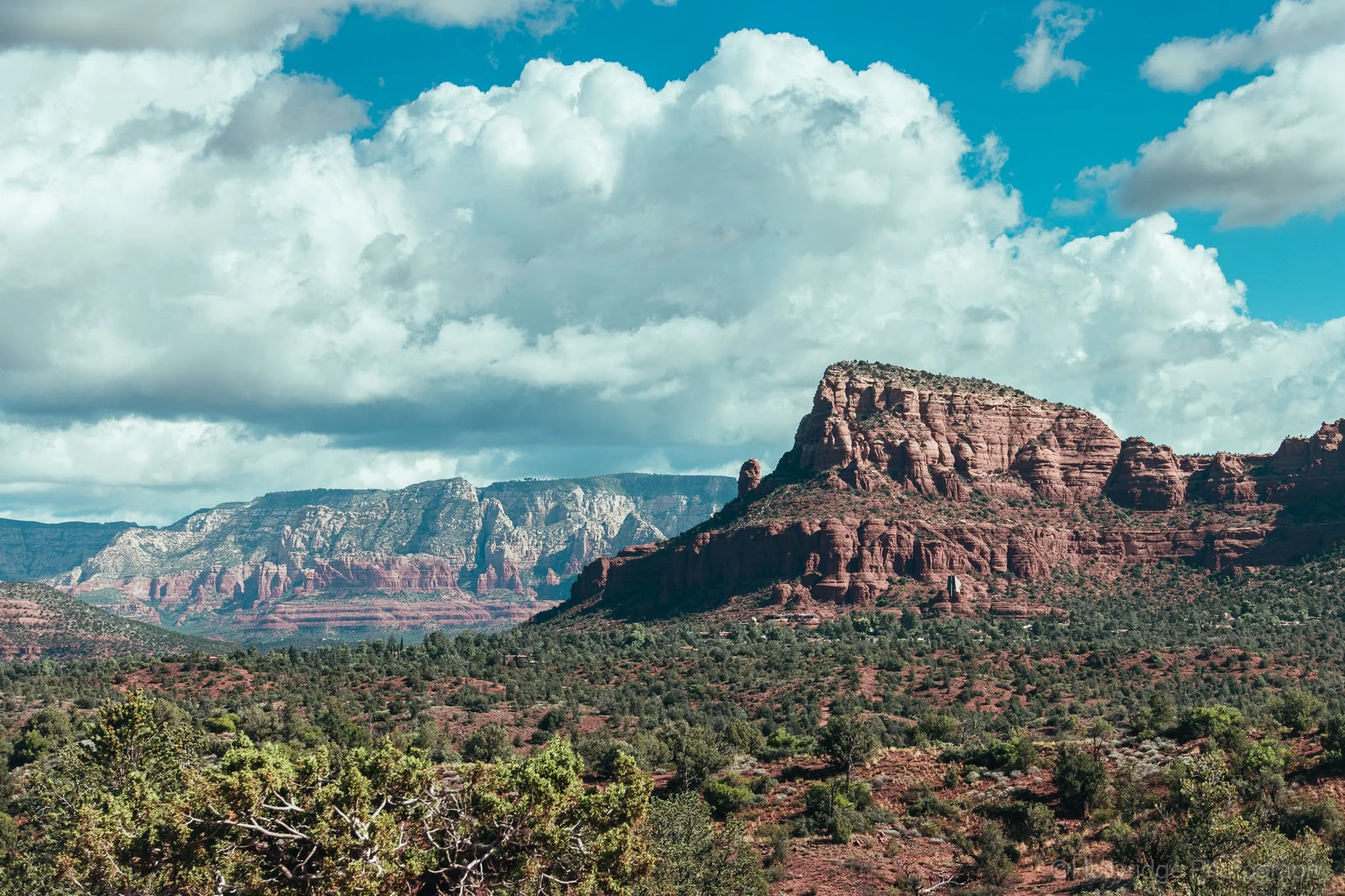 Chapel of the Holy Cross built into red rock cliffs in Sedona, Arizona under clear blue sky