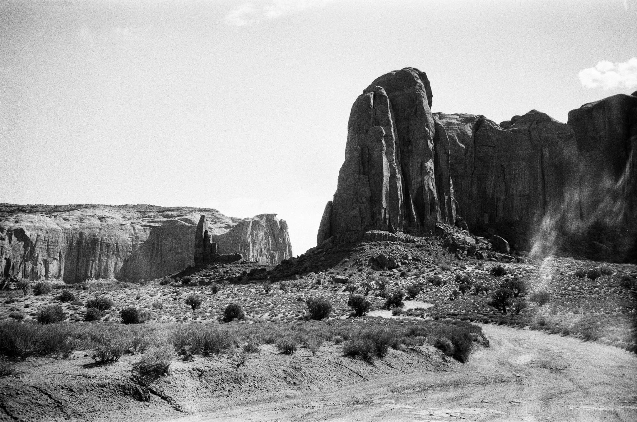Black and white Monument Valley rock formations in analog landscape photography