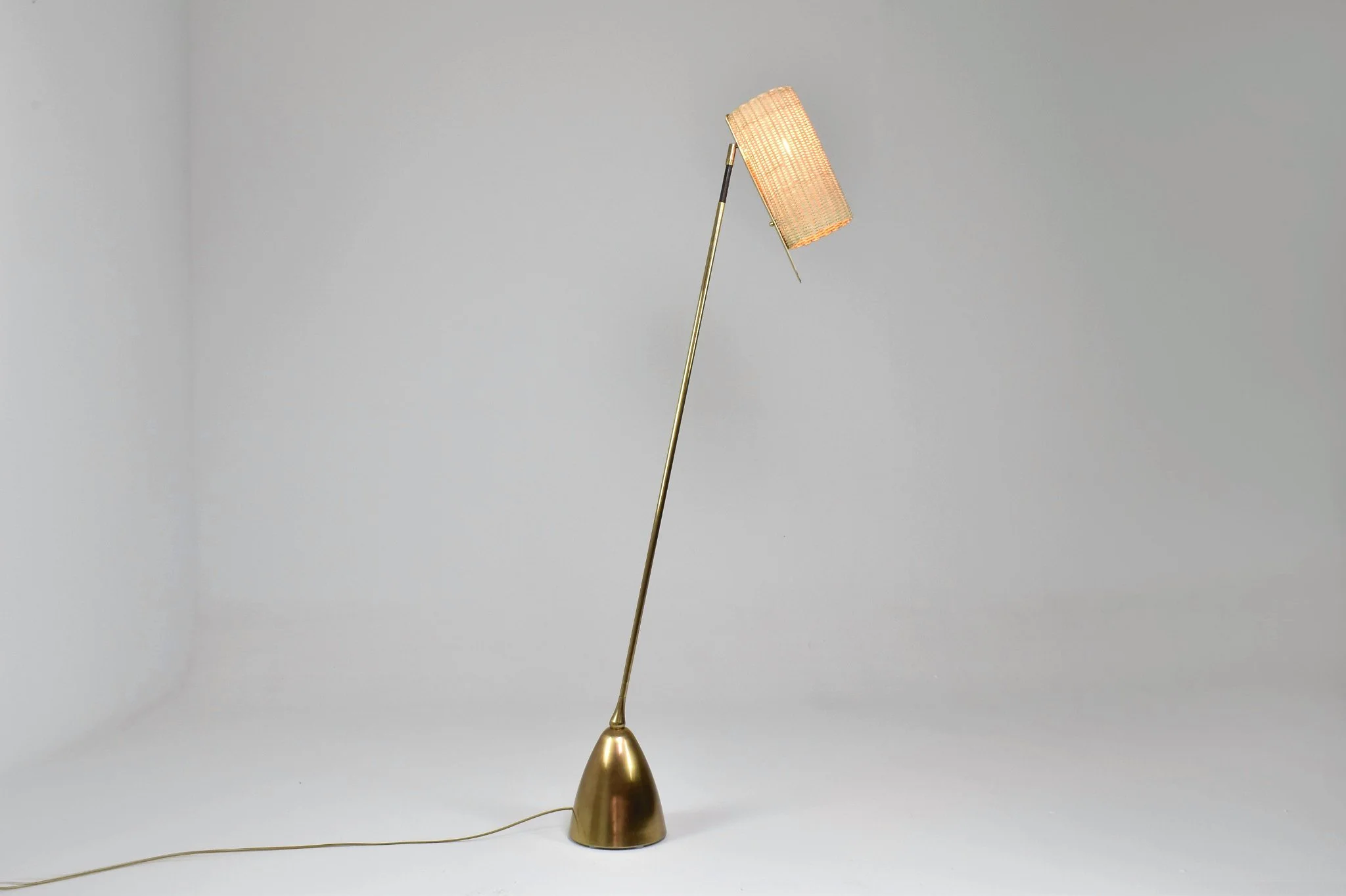 DE LIGHT F2 handcrafted brass and woven rattan floor lamp by Jonathan Amar Studio.  
