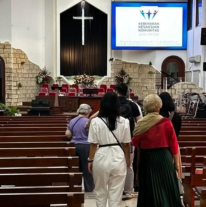 The Mission Team is gathering to worship alongside fellow believers. 

The sign in the background says: 

&ldquo;THE TRUTH OF COMMUNITY TESTIMONY
CALVARY 2026

Becoming a Church that Disciples Every Believer to Grow in Christ and be Sent for the Gosp
