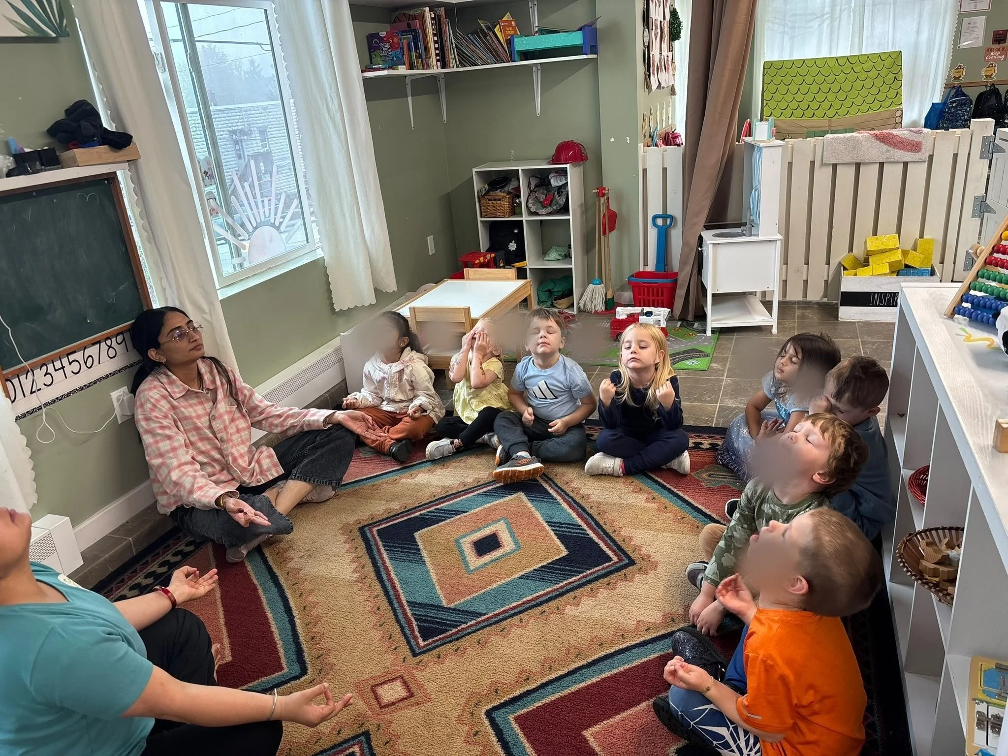 Children doing morning yoga at circle time