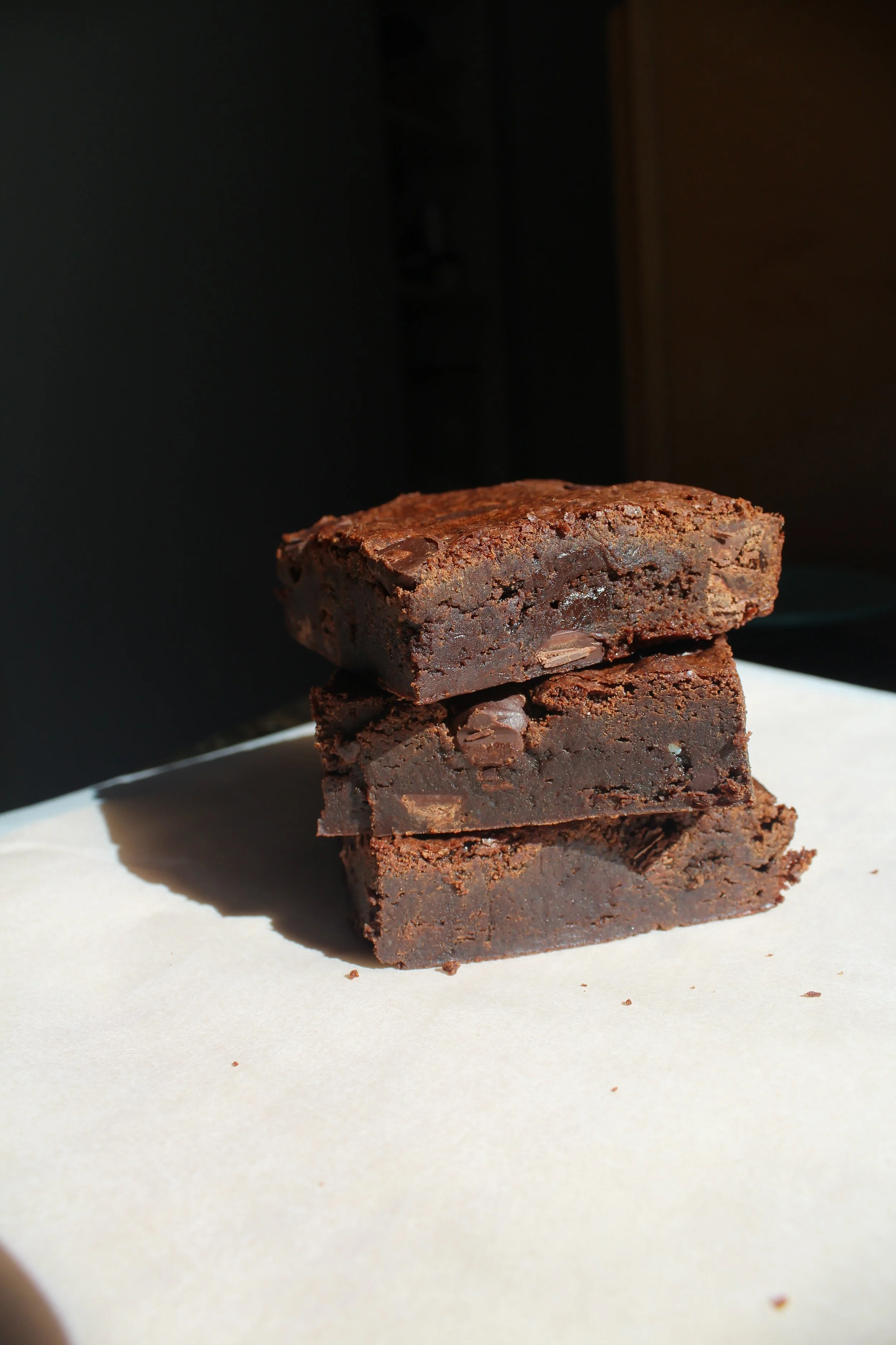 Three brownies stacked on top of each other.