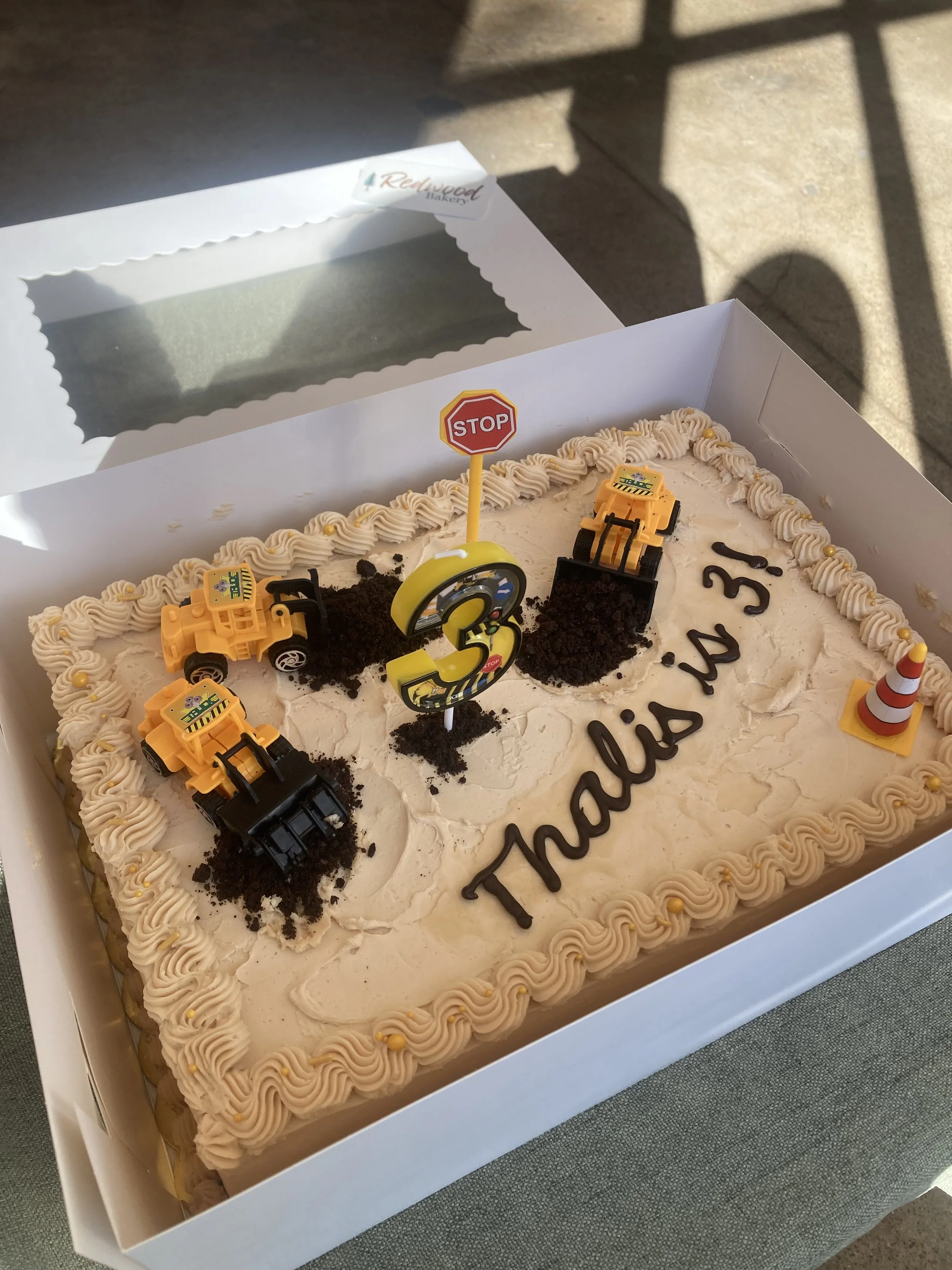 Cake decorated to look like a construction site.