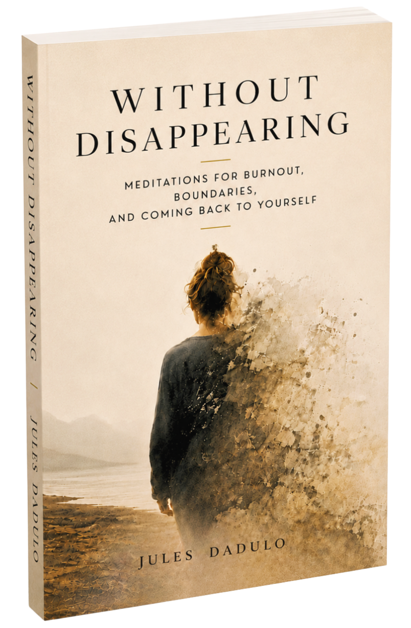 Book cover titled "Without Disappearing" by Jules Dadulo, featuring a woman with curly hair standing on a beach, with the right side of her body dissolving into a watercolor splash.
