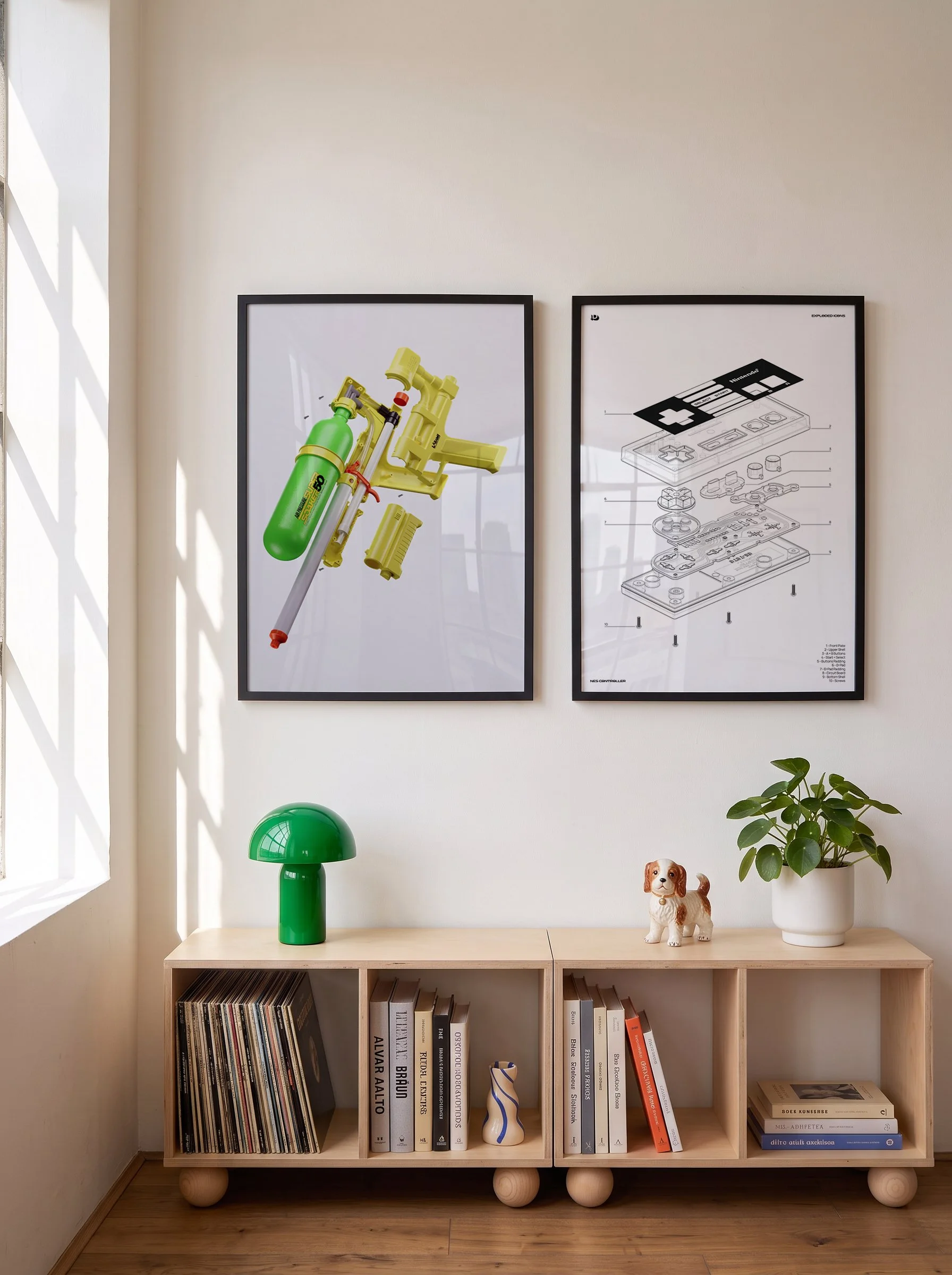 A wooden bookshelf with spherical legs filled with books and magazines on the bottom shelf, a green table lamp and a ceramic dog figurine on top, a white pot with a green leafy plant, a green table lamp, and two framed posters on the wall behind the bookshelf.