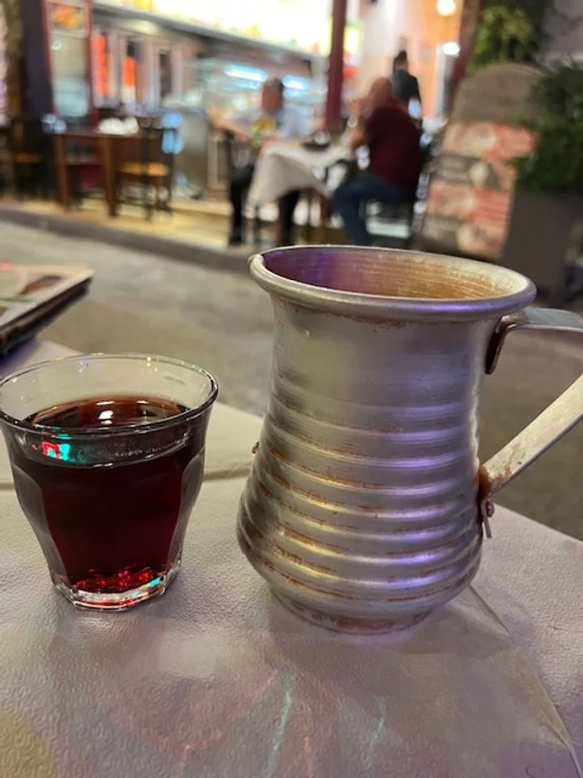 Red wine with tin pitcher
