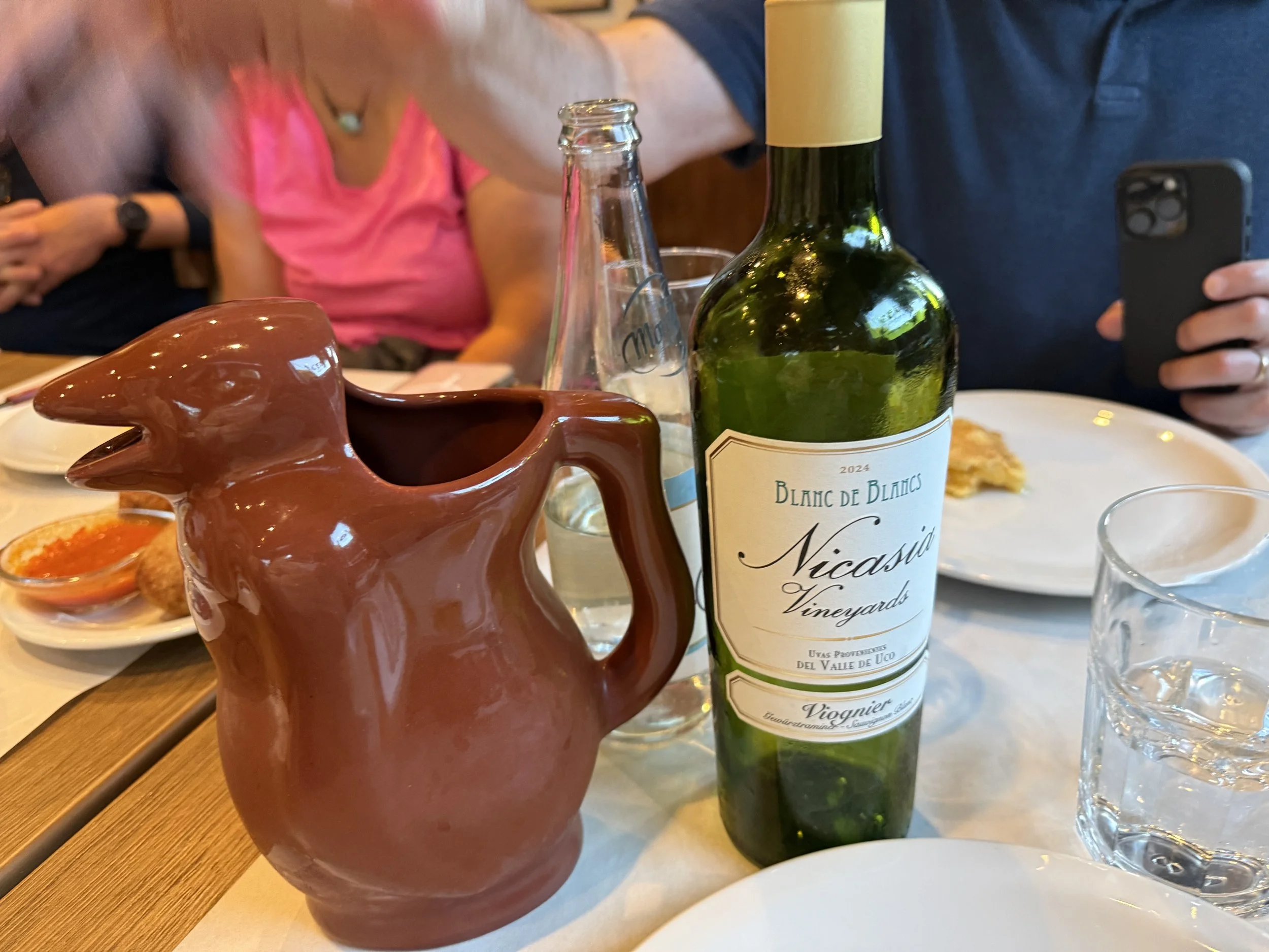 Wine with penguin pitcher.
