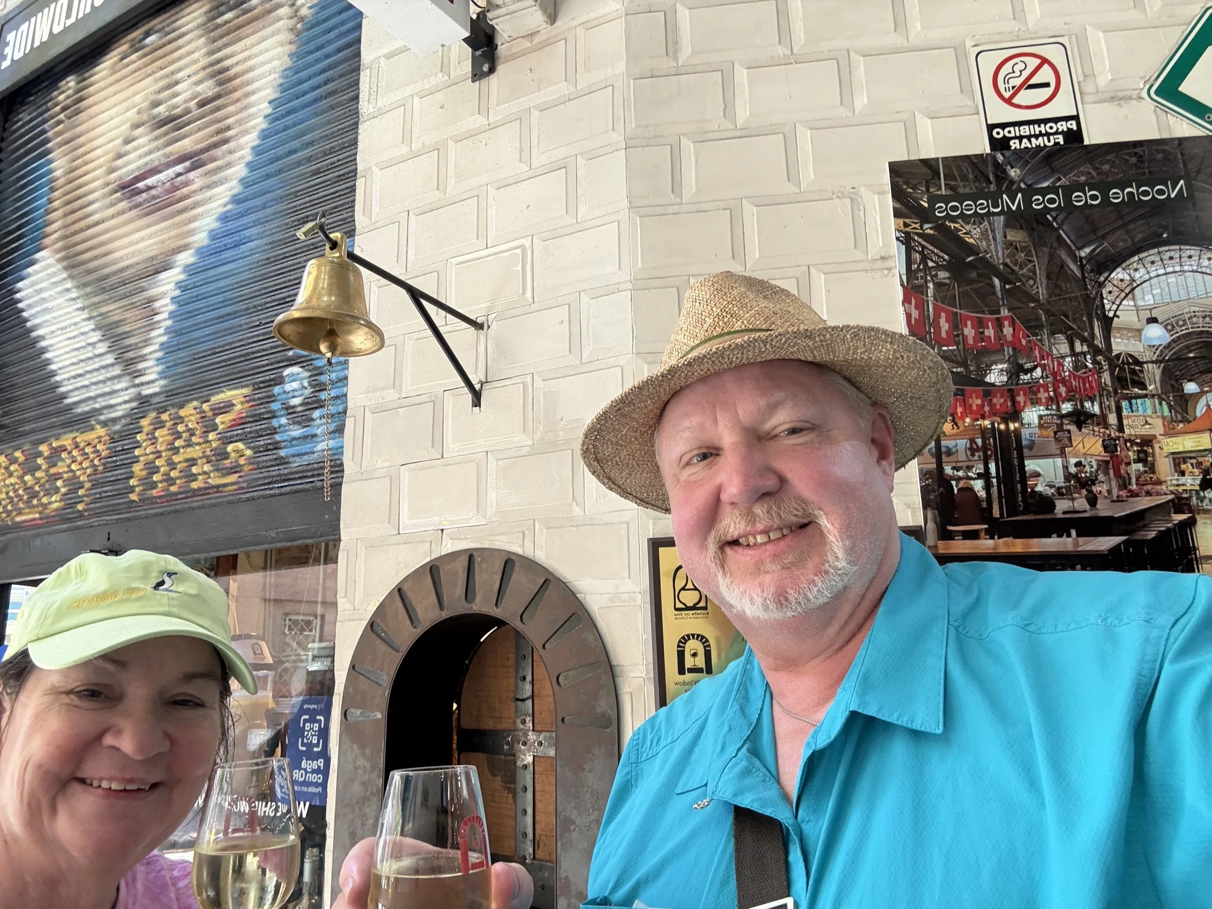 Ring the bell and get wine from the window below it.