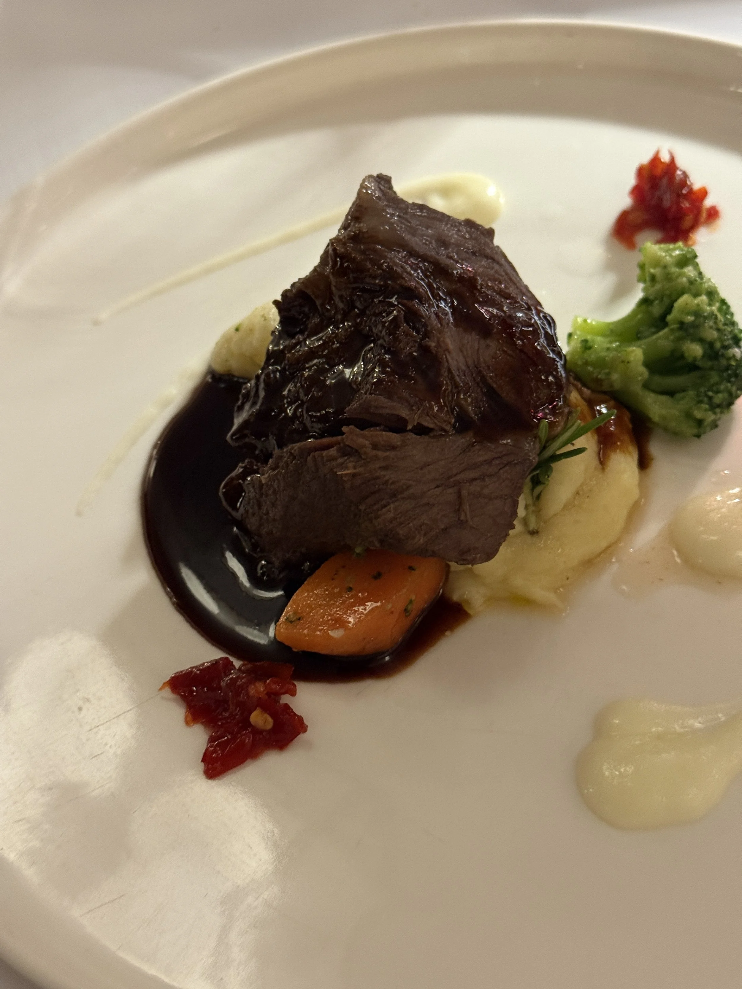 Beef sheek in Barolo wine on cream potatoes, cheese mozzarella reduction and chilli jam