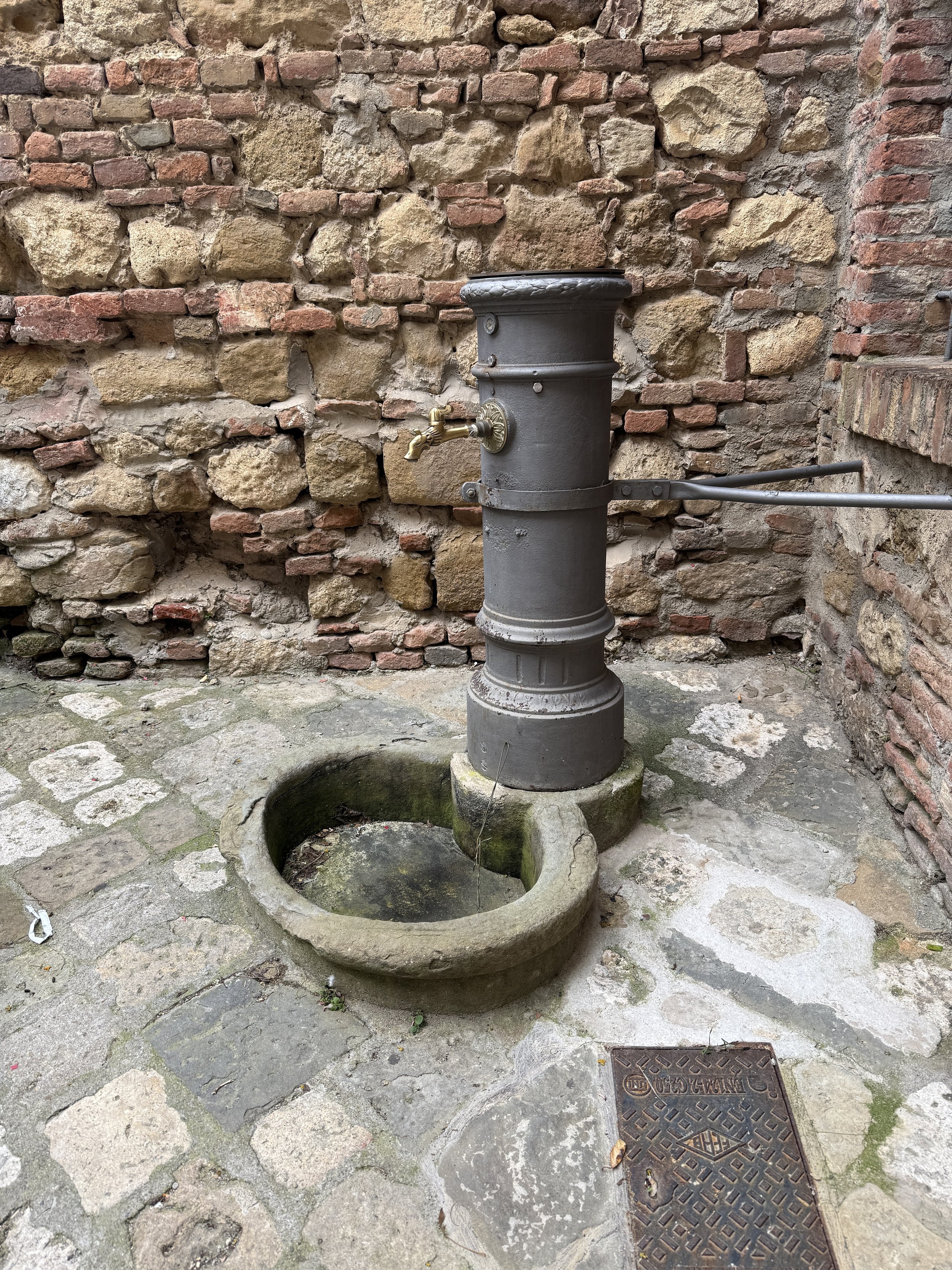 old well in alley near our place