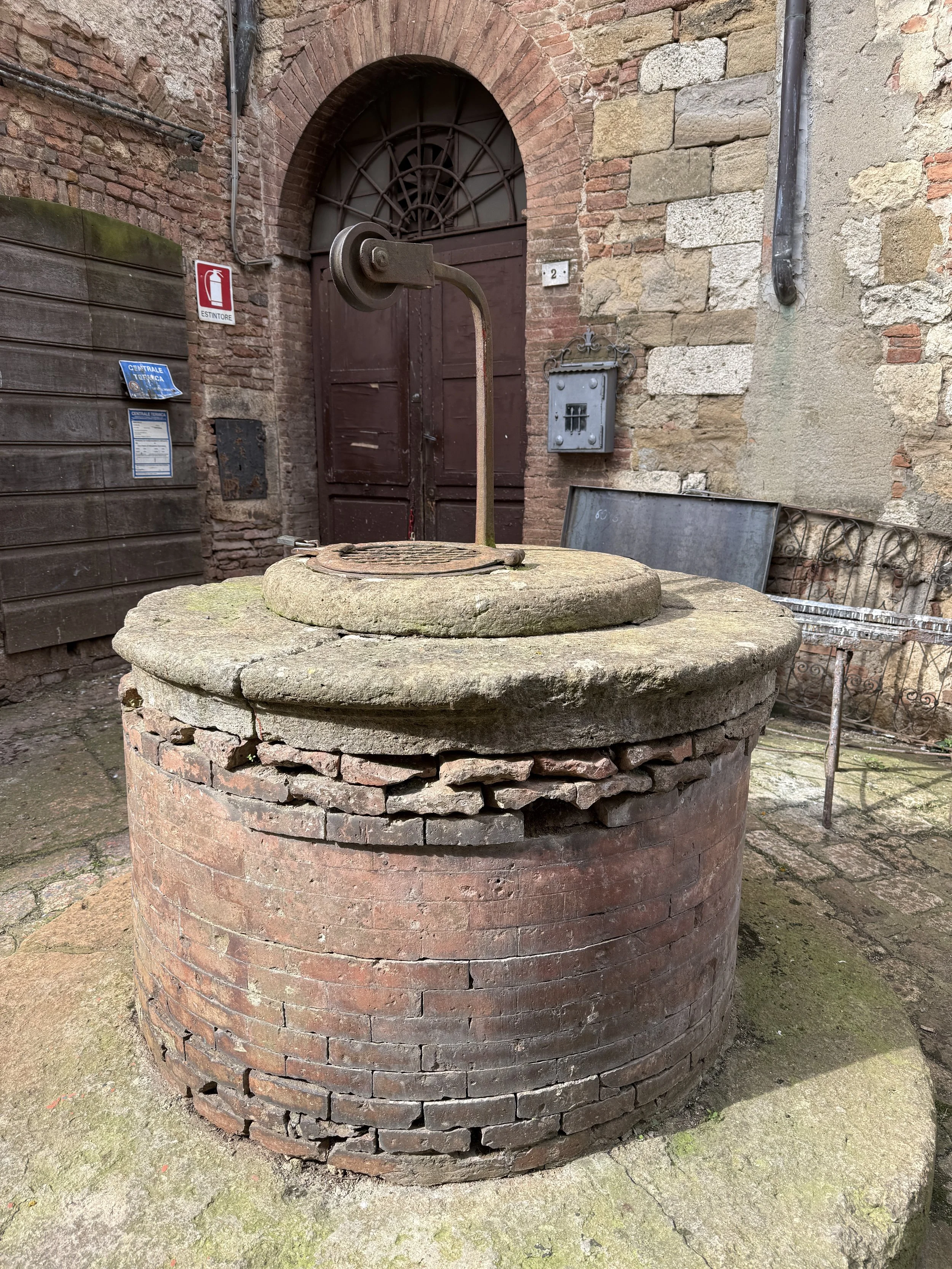 Old well with pulley to bring water up.
