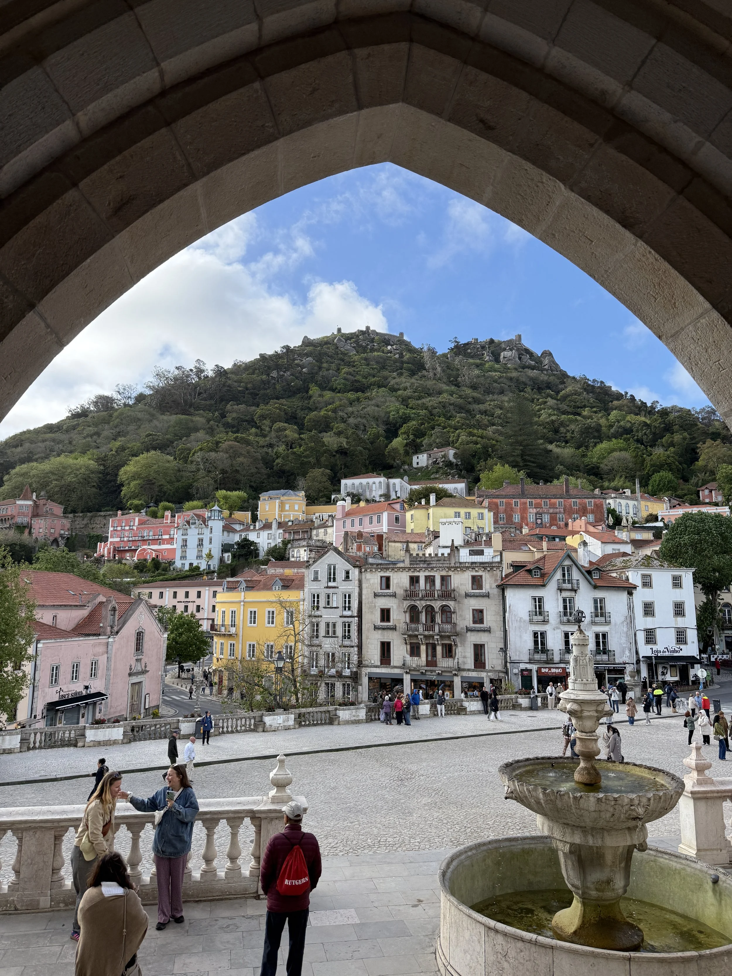 Arch photo with fountain and castle