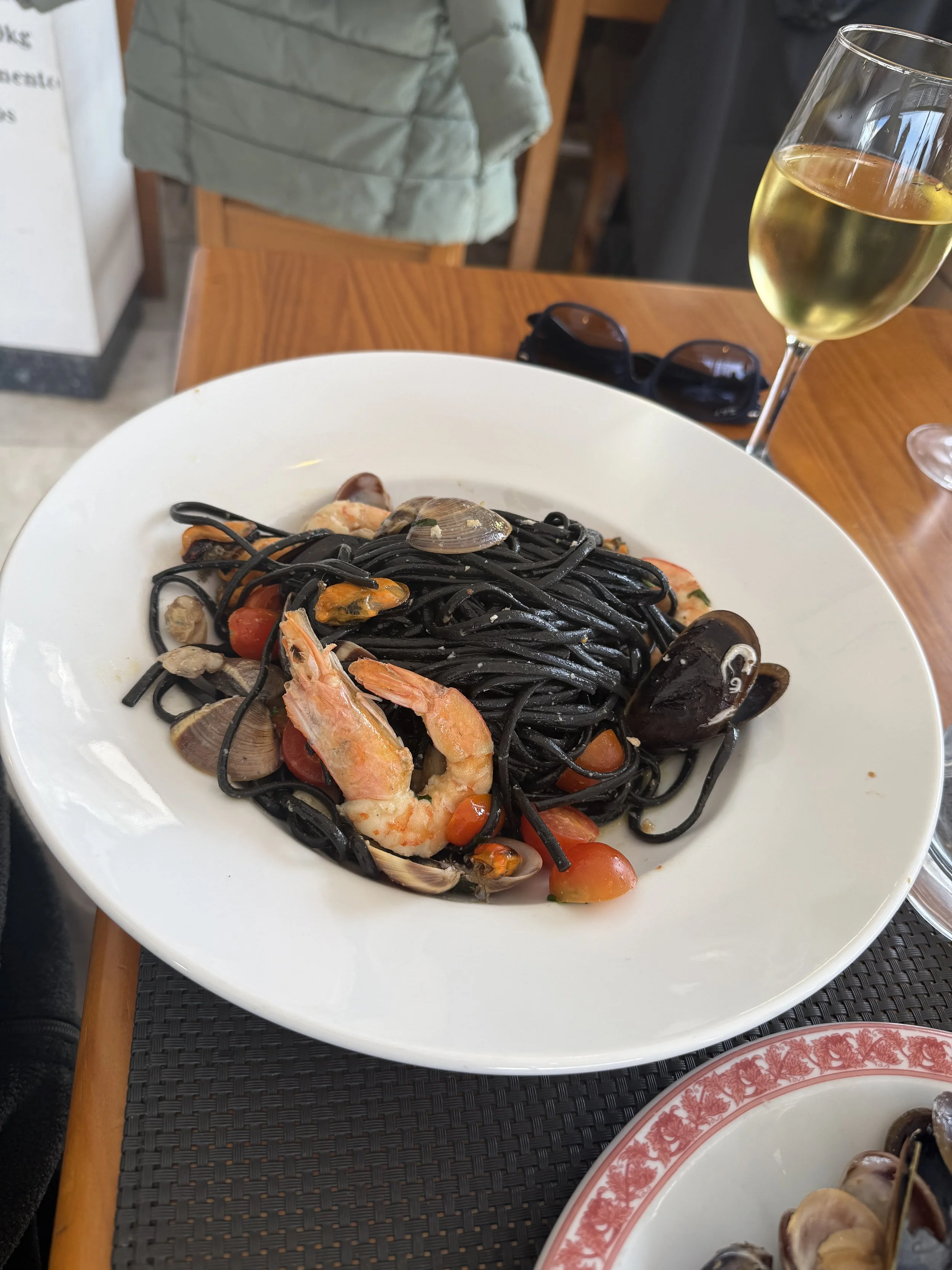 squid ink pasta with prawns and clams