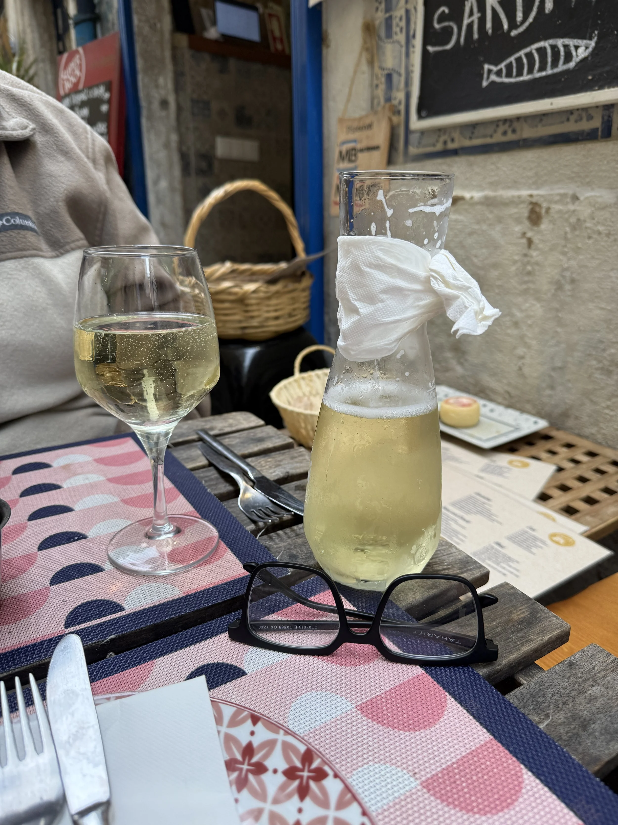small carafe of green wine.