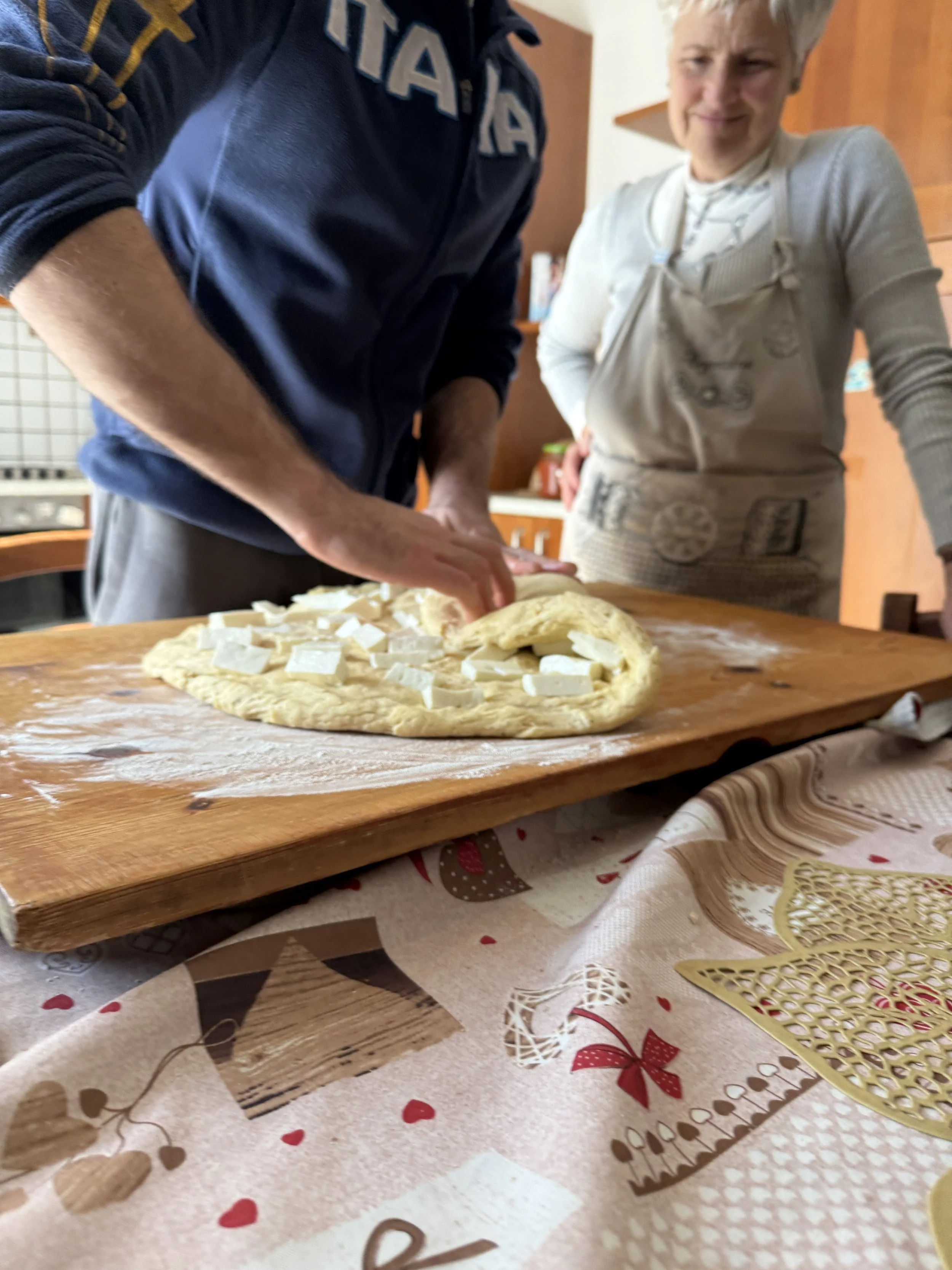 Folding in the Pecorino Cheese.