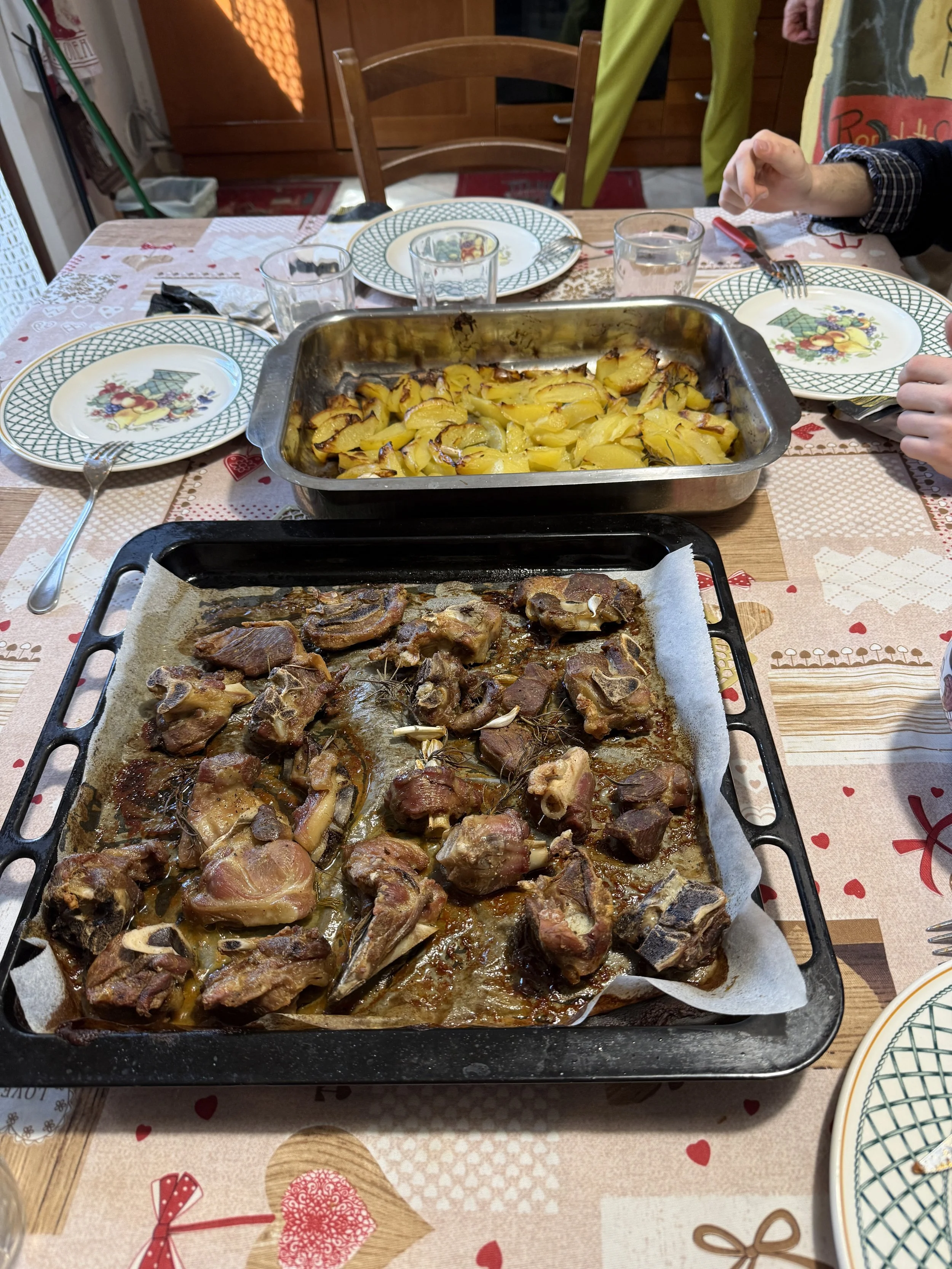 Roasted lamb and Potatoes with rosemary and olive oil.