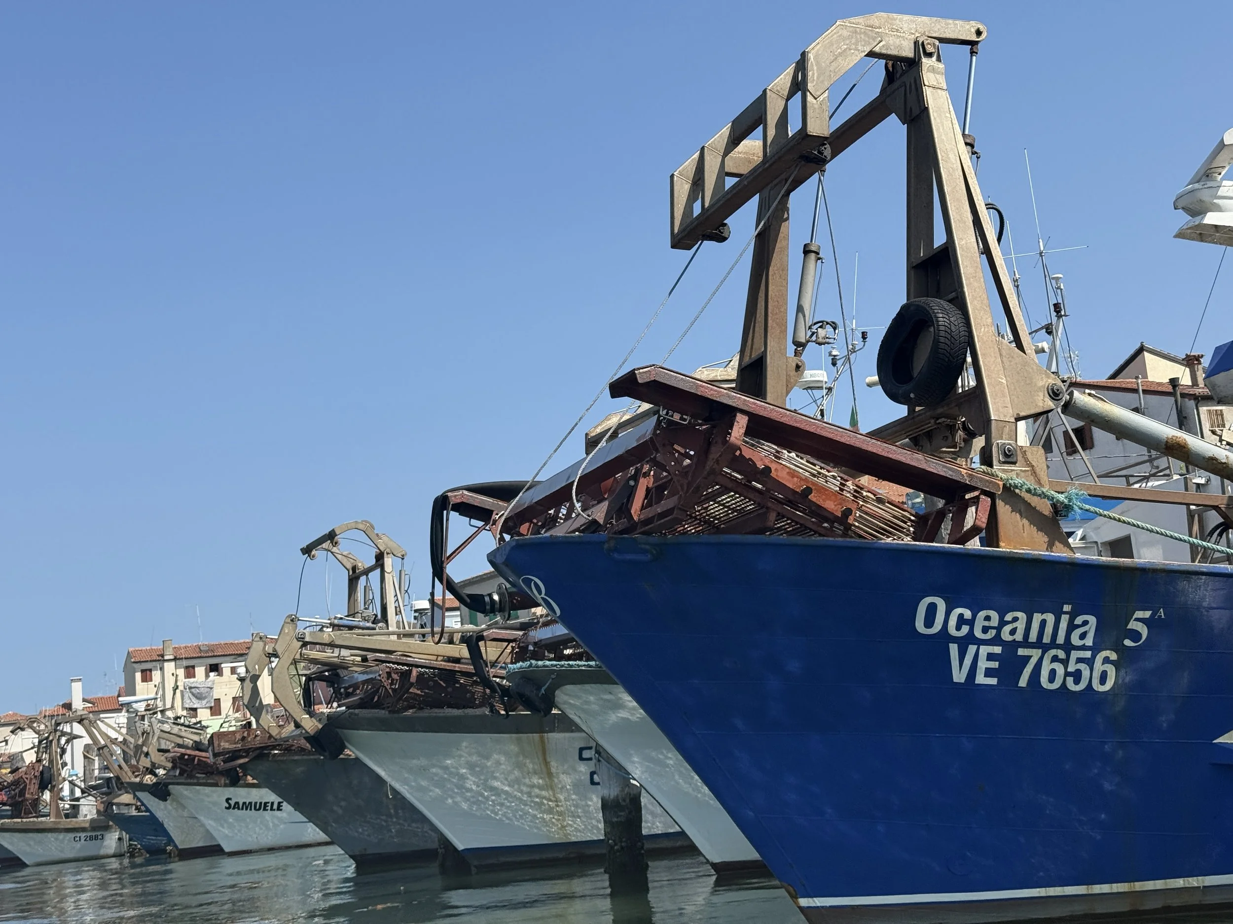 Calm dredgers on the front of the boats