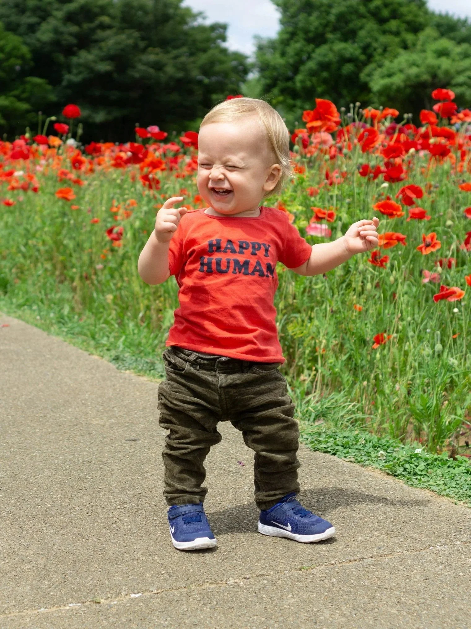 Toddler boy smiling outside during speech therapy with New Leaf Speech Services in Cedar Park TX