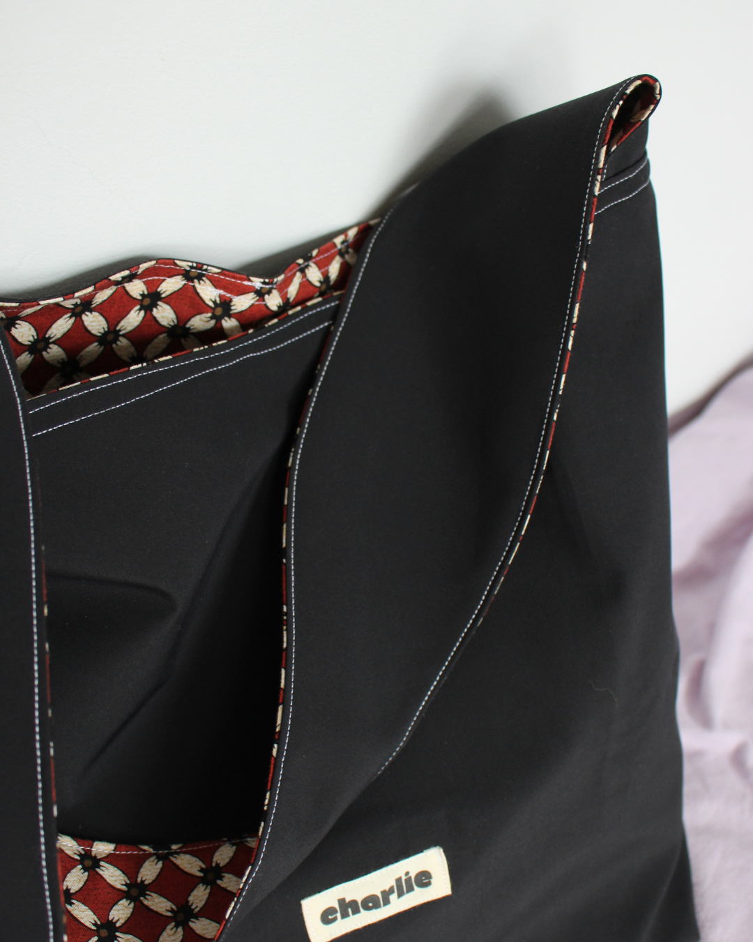 sac-réversible-essentiel-impermeable-noir-rouge-8.png