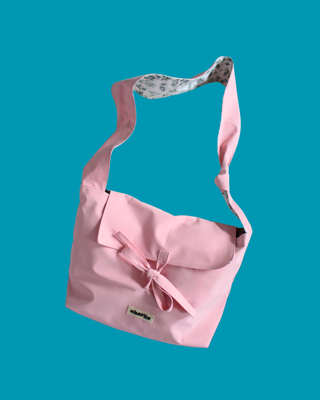 olivia-bandouliere-impermeable-baby-pink-1.png